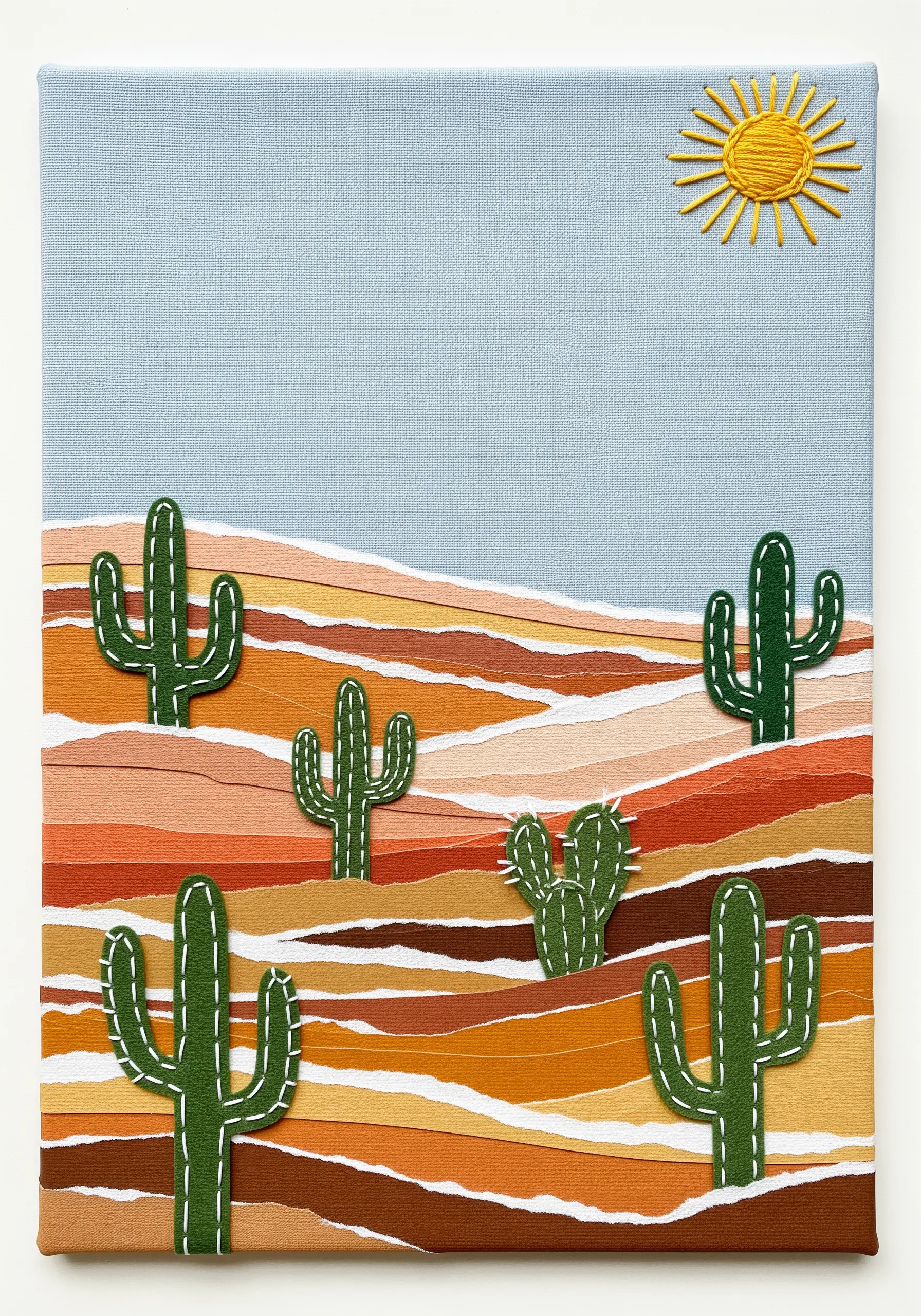 Desert landscape collage with felt cacti detailed with a simple white running stitch.