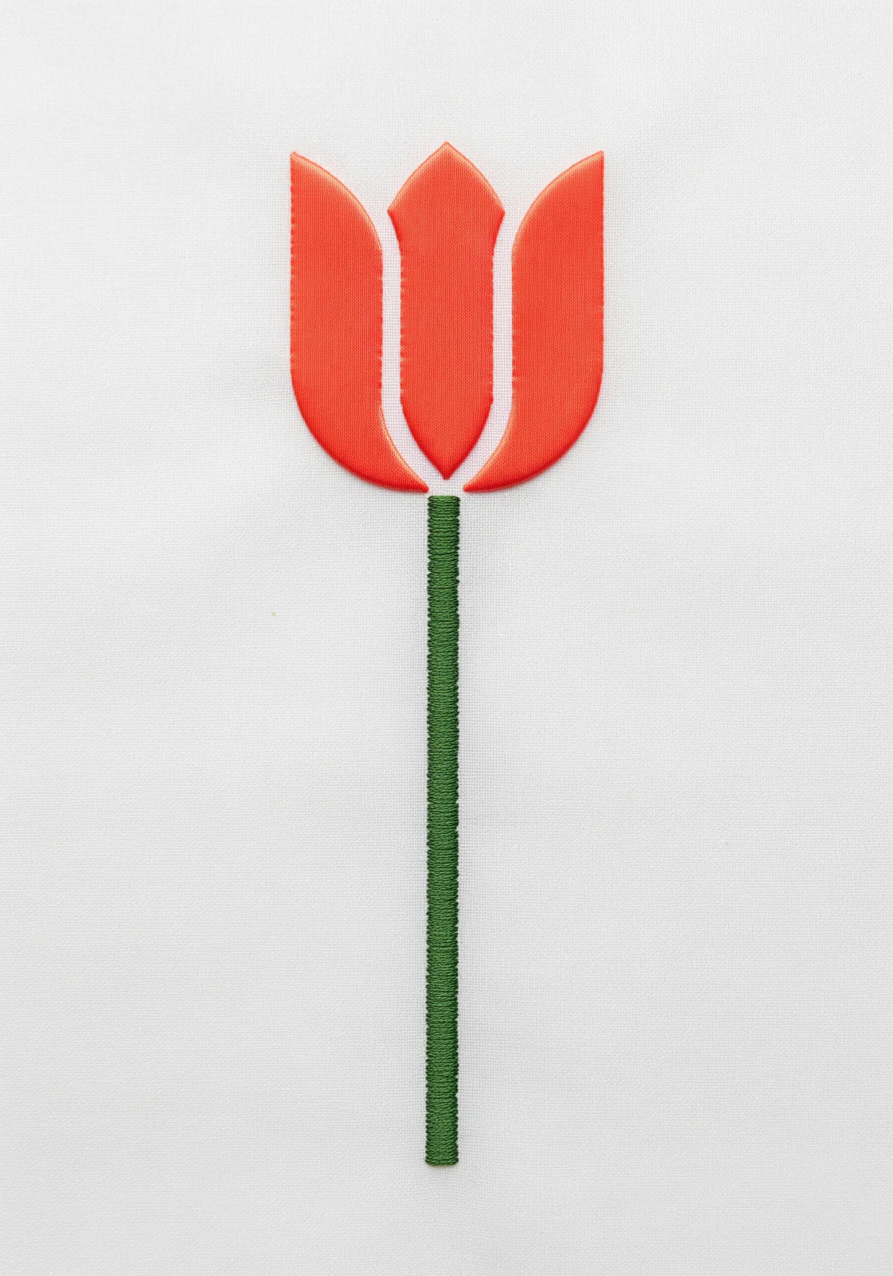 A modern, graphic tulip with three red satin-stitched petals separated by negative space.