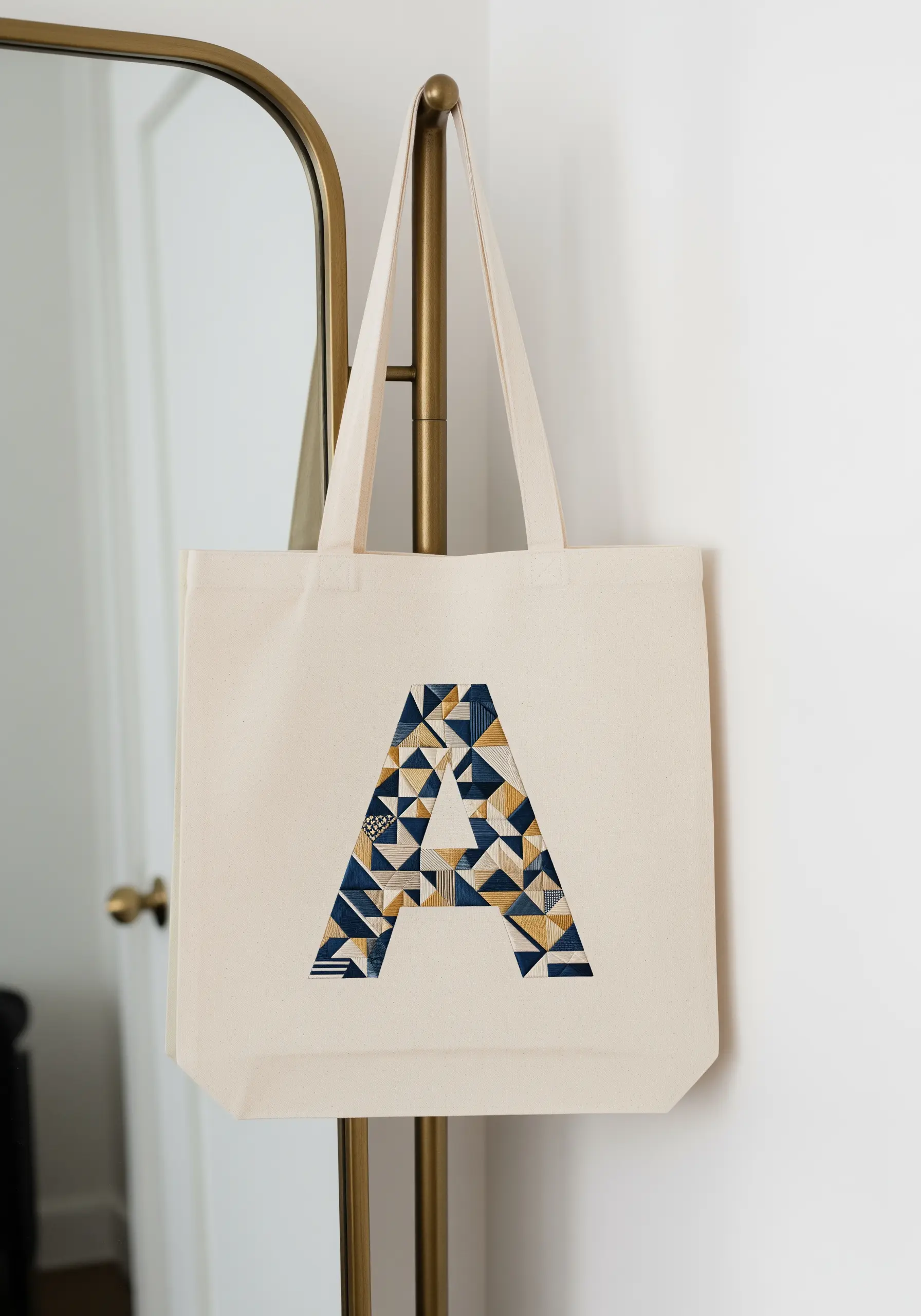 A large letter 'A' filled with a patchwork of different geometric stitch patterns.