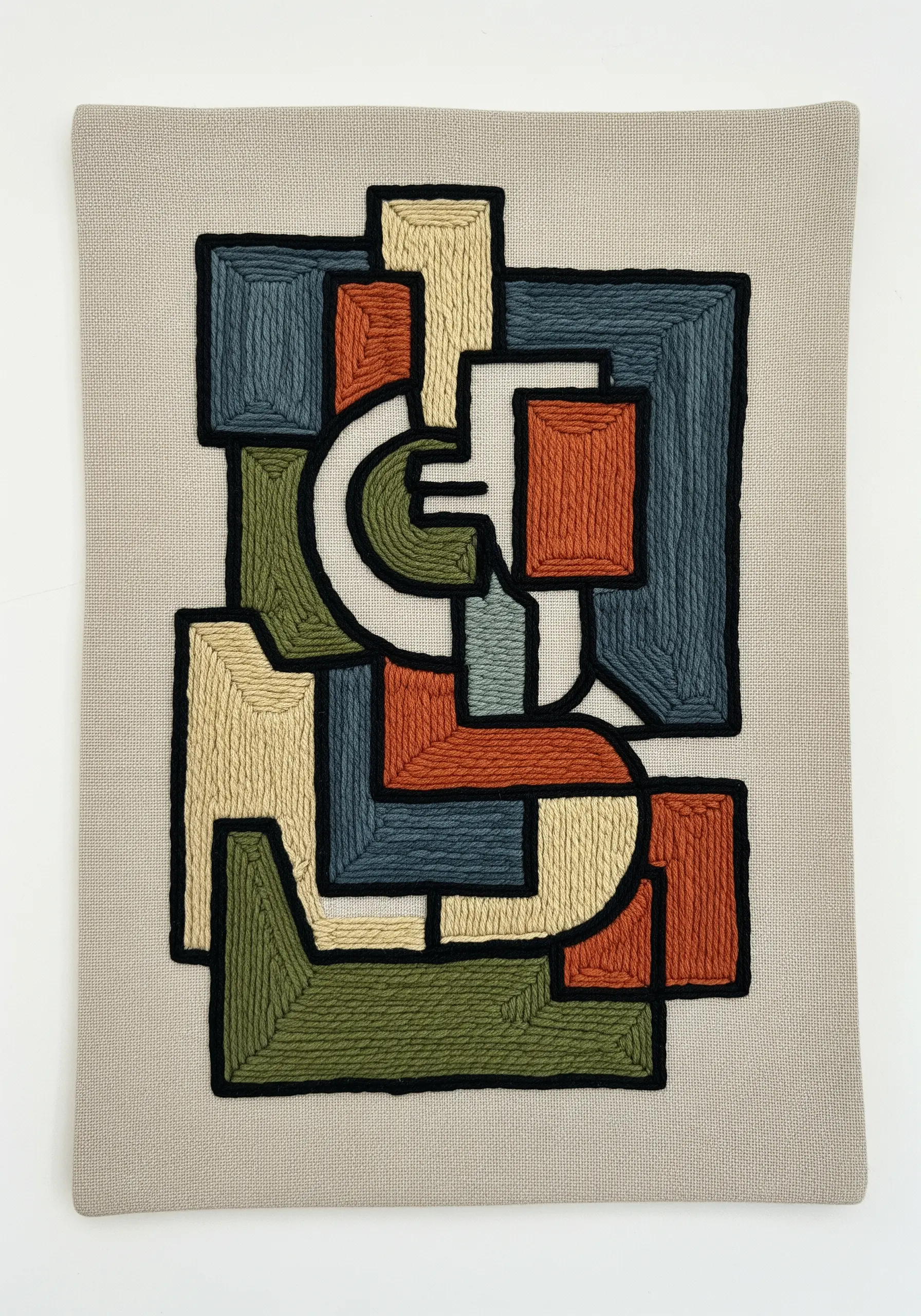 Abstract geometric embroidery with earth tone color blocks