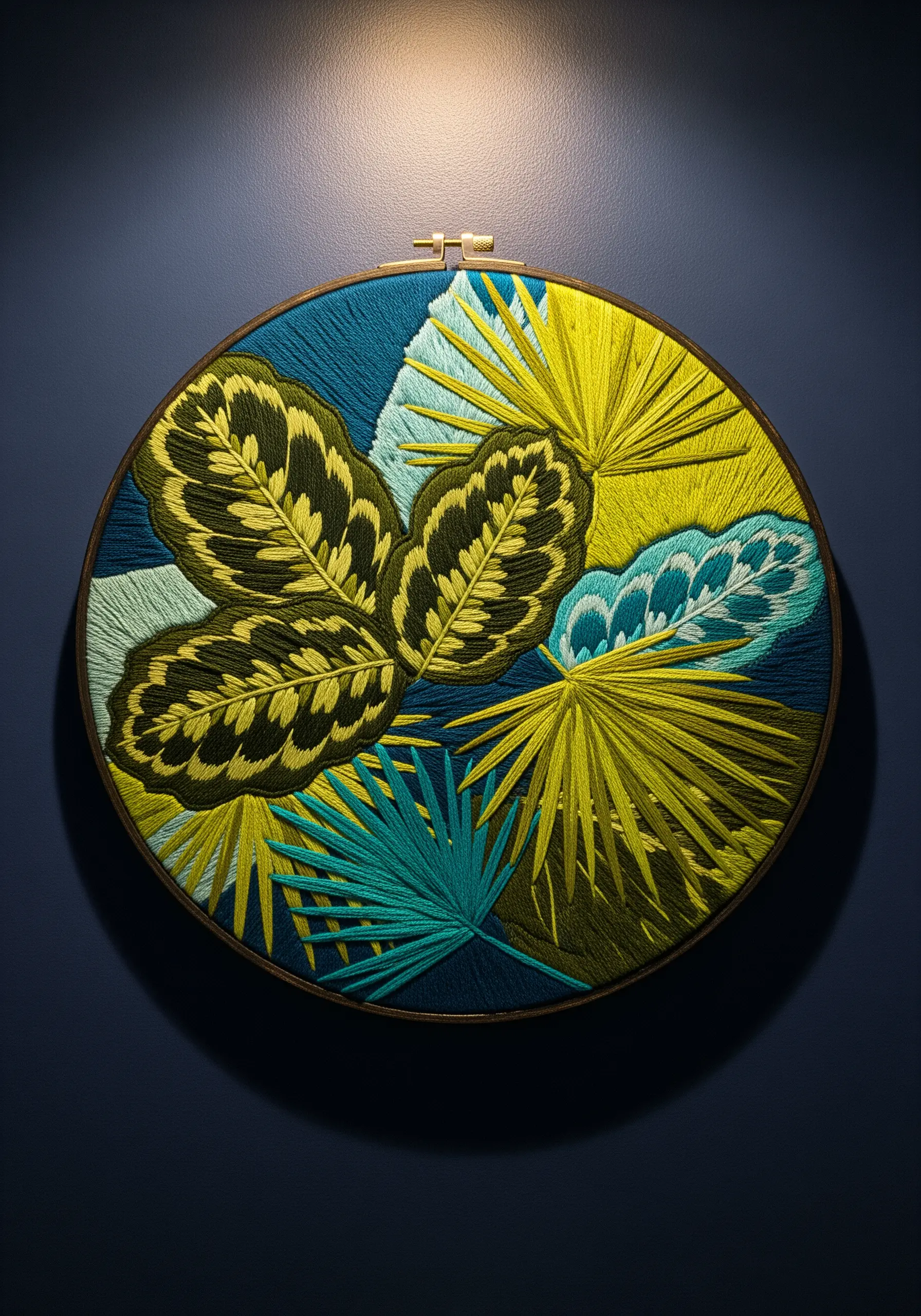 Bold tropical leaf embroidery with vibrant yellow, green, and teal on dark fabric.