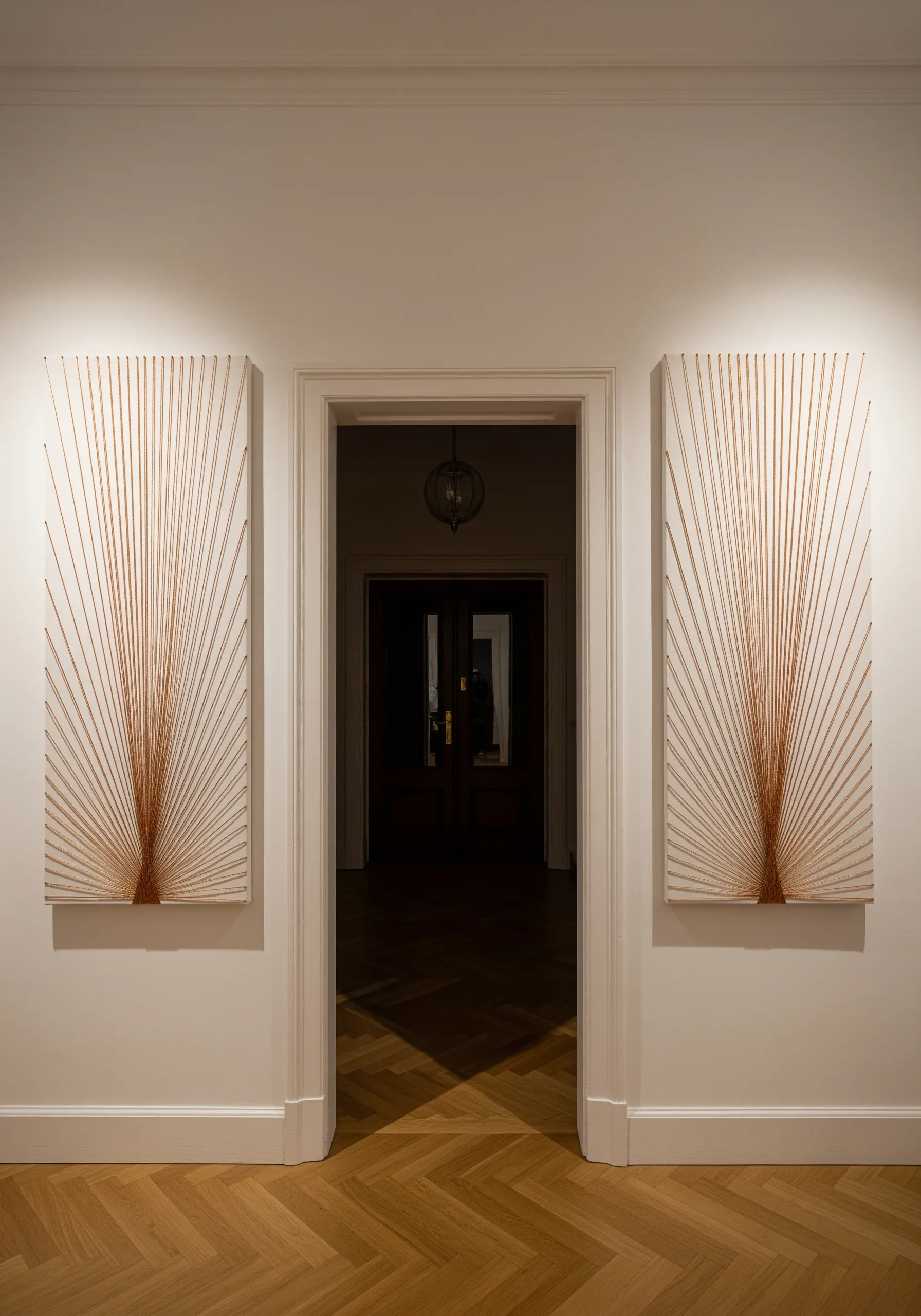 A diptych of large-scale string art panels with threads fanning out from a central point.