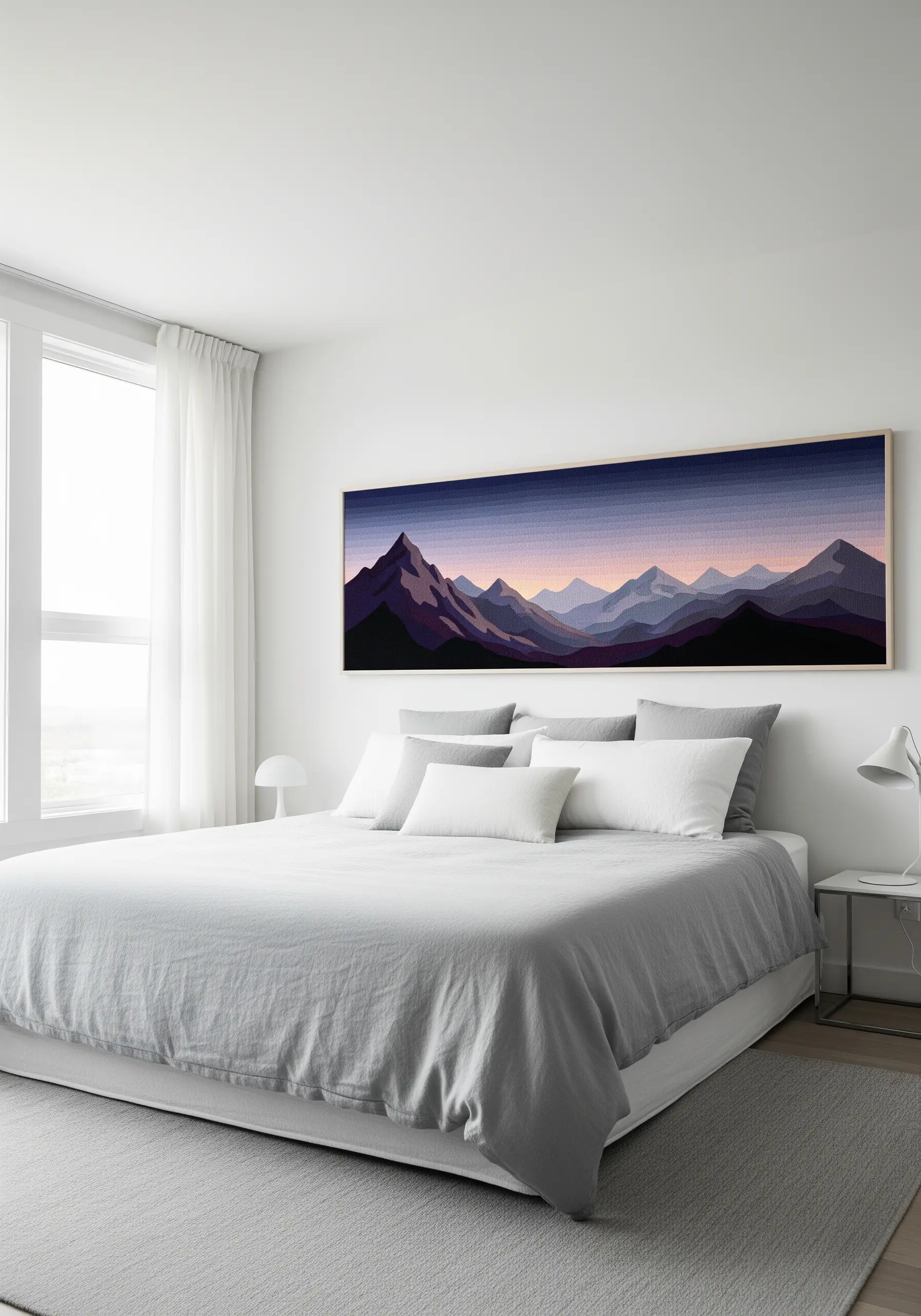 Wide panoramic embroidery of purple mountains over bed