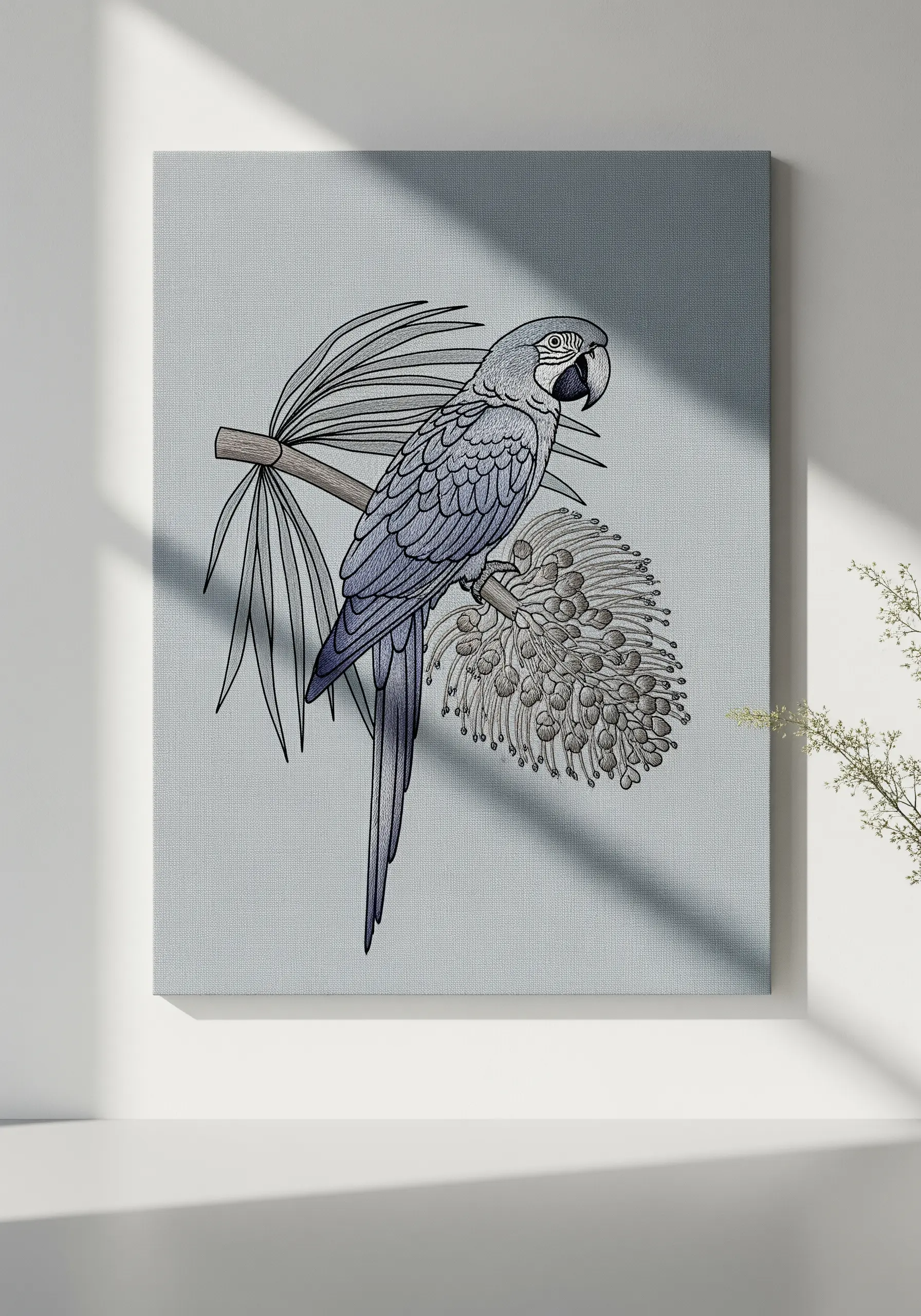 A minimalist line-art embroidery of a parrot and tropical leaves on a grey canvas.