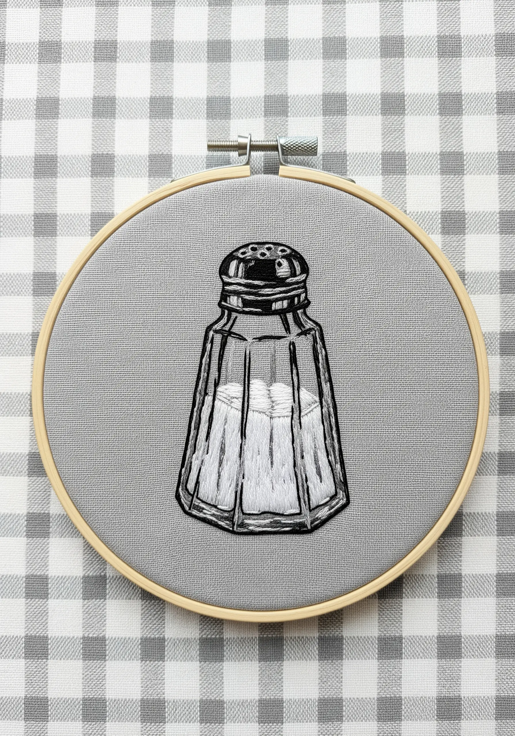 Blackwork embroidery of a salt shaker using cross-hatching