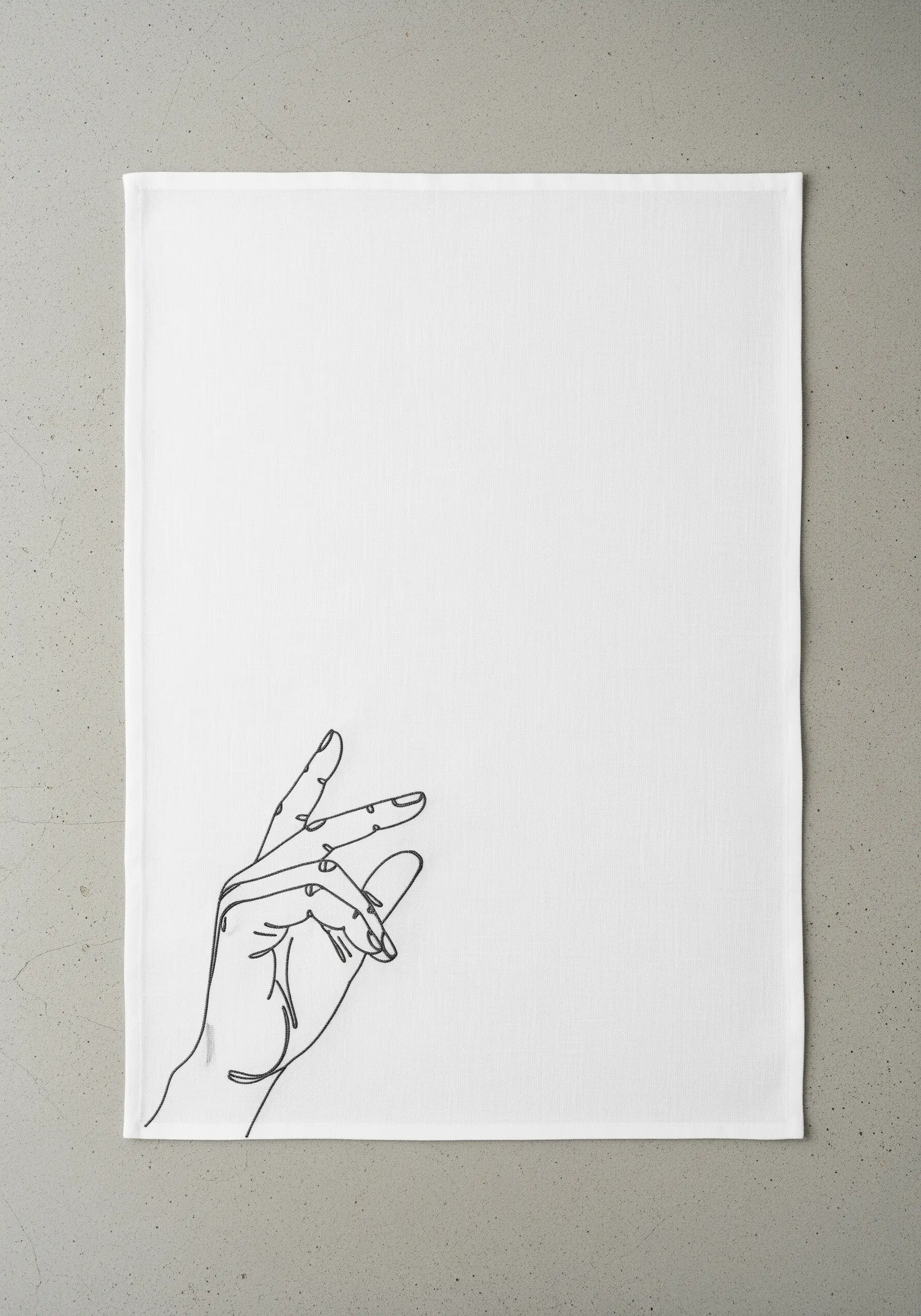 An elegant line-art hand gesture embroidered in black thread on a white linen towel.