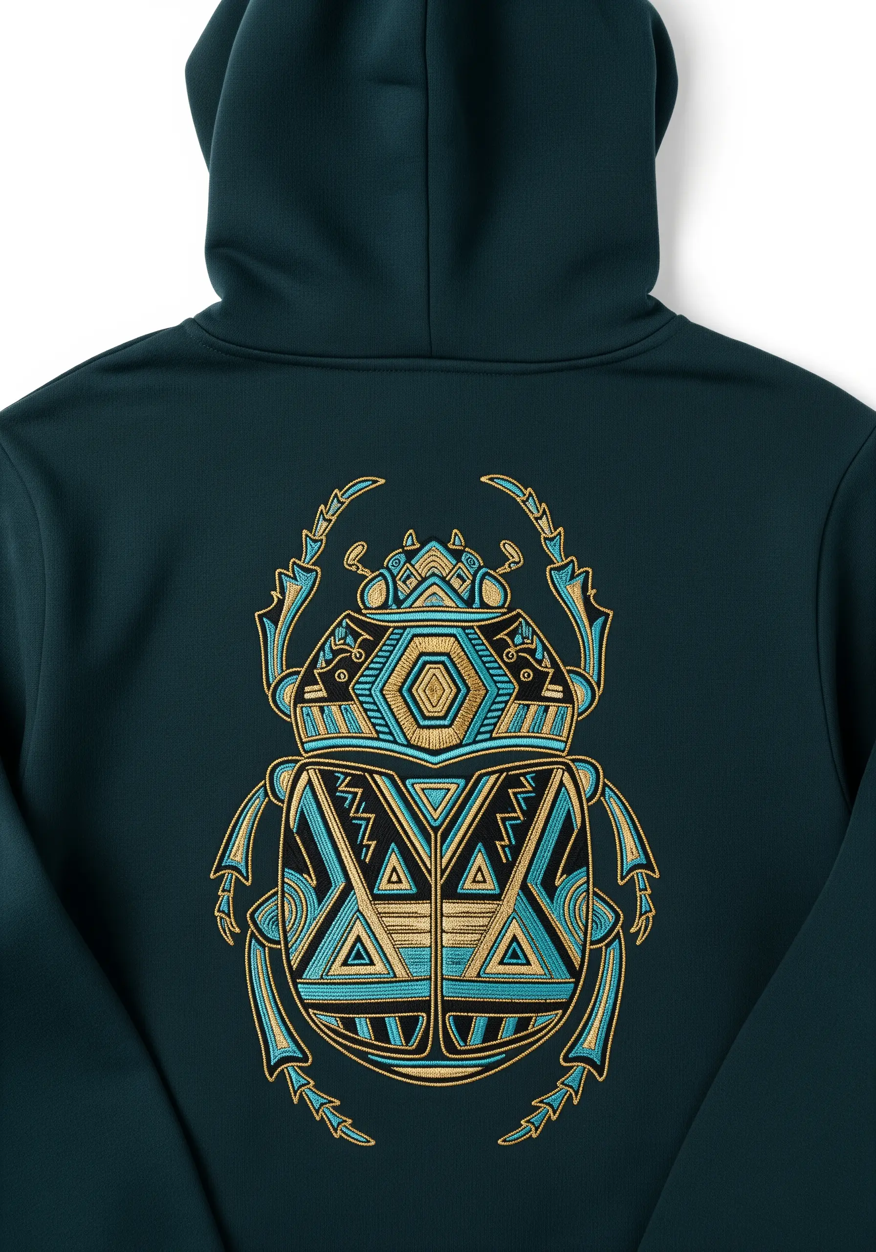 A geometric beetle with gold and turquoise patterns embroidered on a dark teal hoodie.