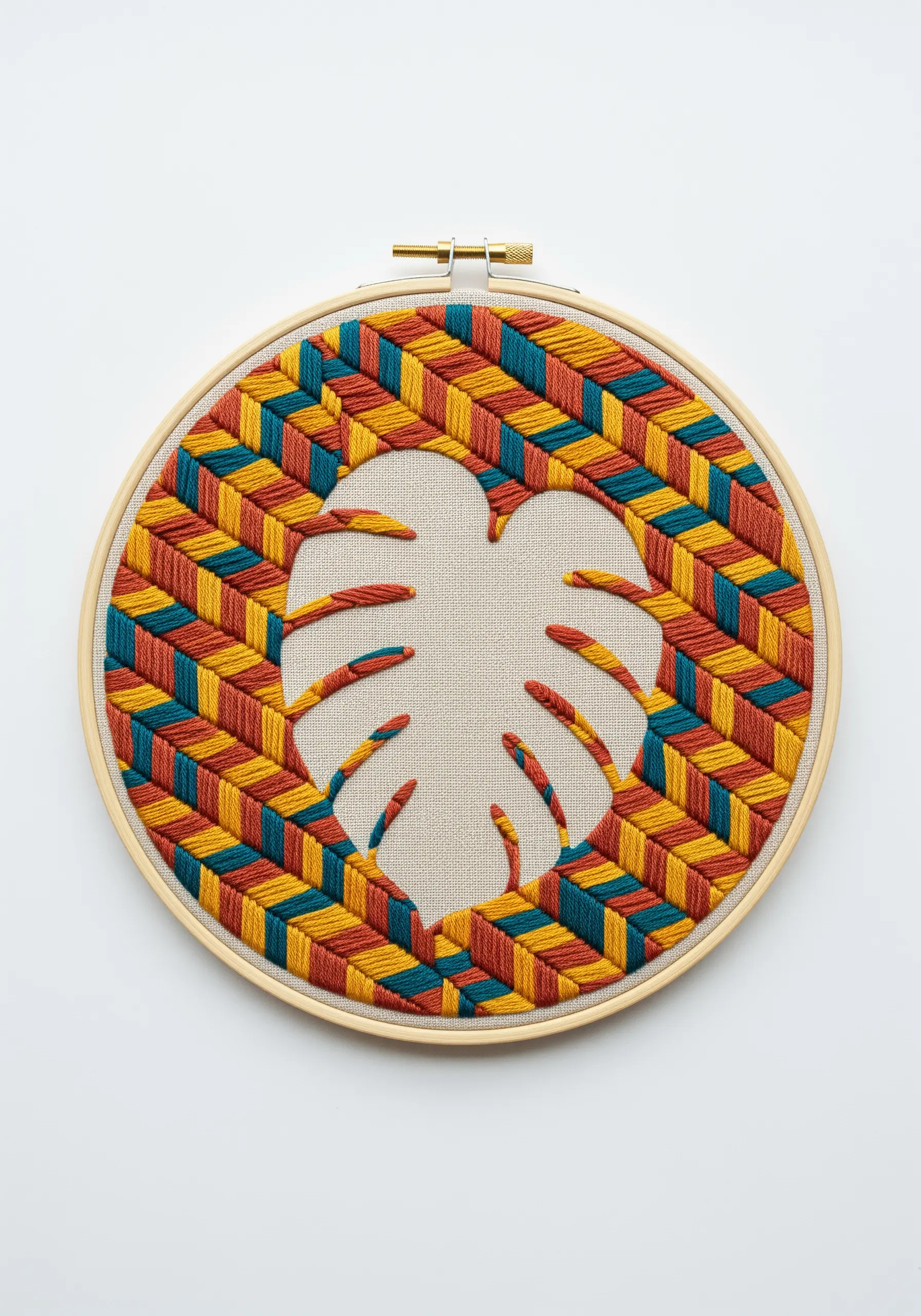 Monstera leaf silhouette created with negative space on a colorful geometric stitch background.