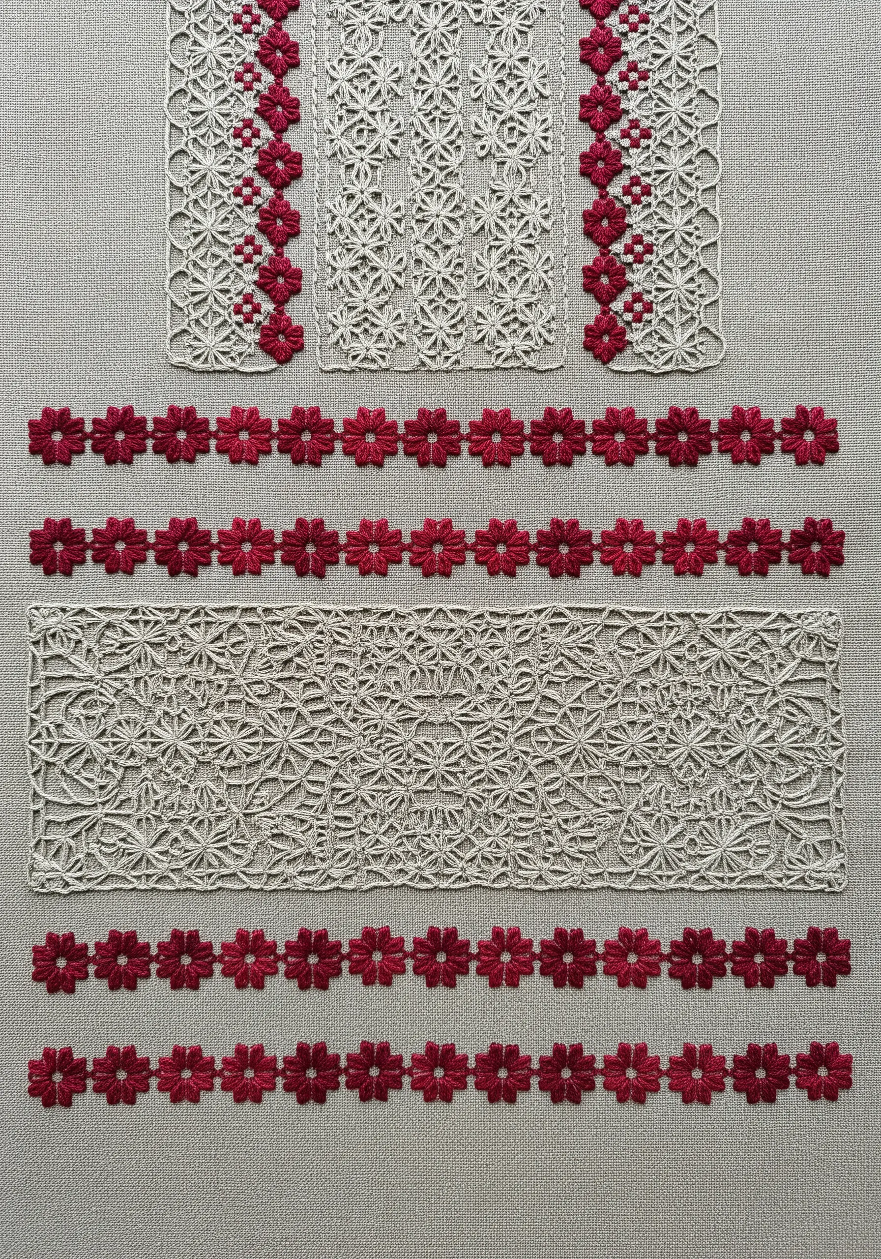 A sampler combining panels of white drawn-thread work with bands of deep red floral embroidery.
