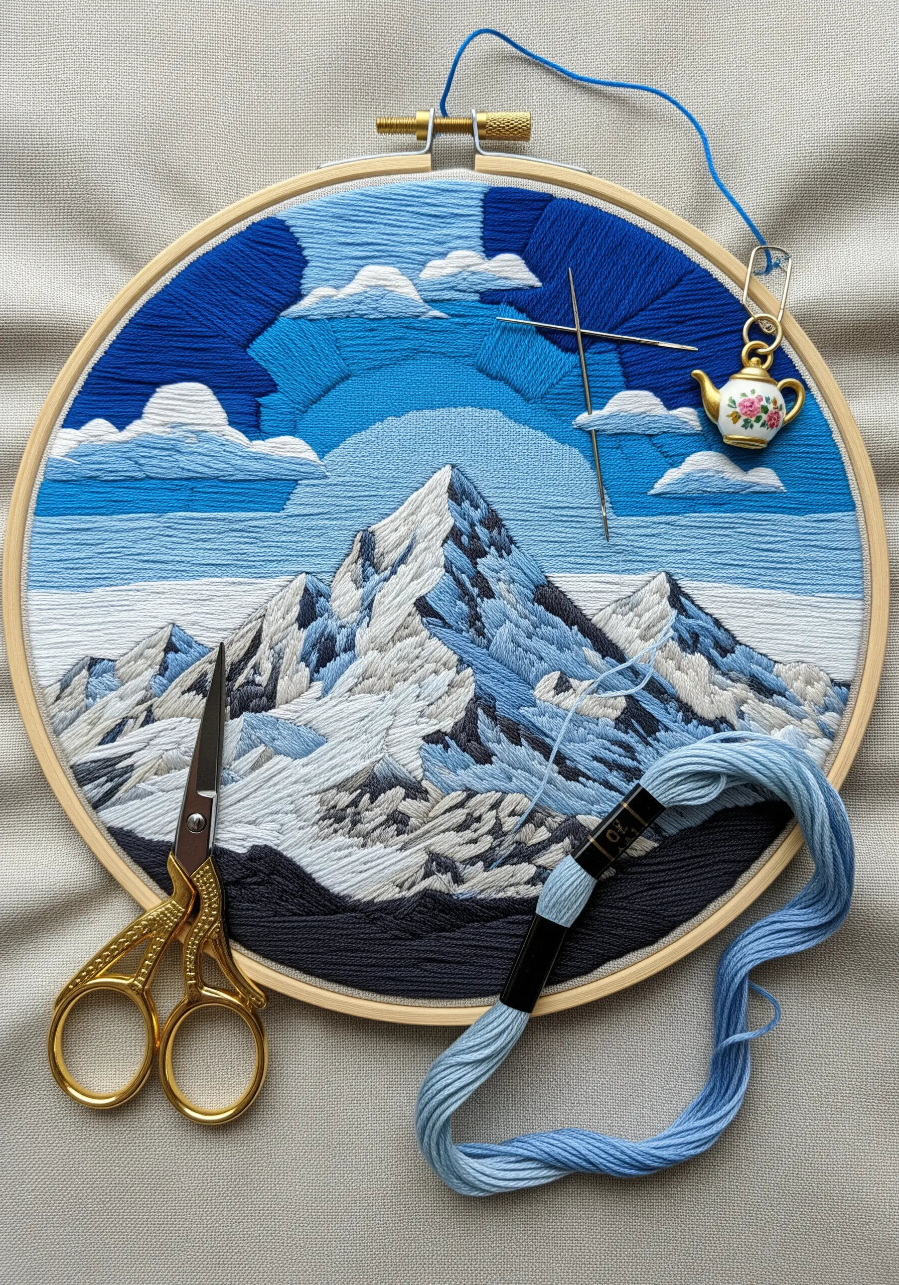 Geometric mountain and sky embroidery with scissors