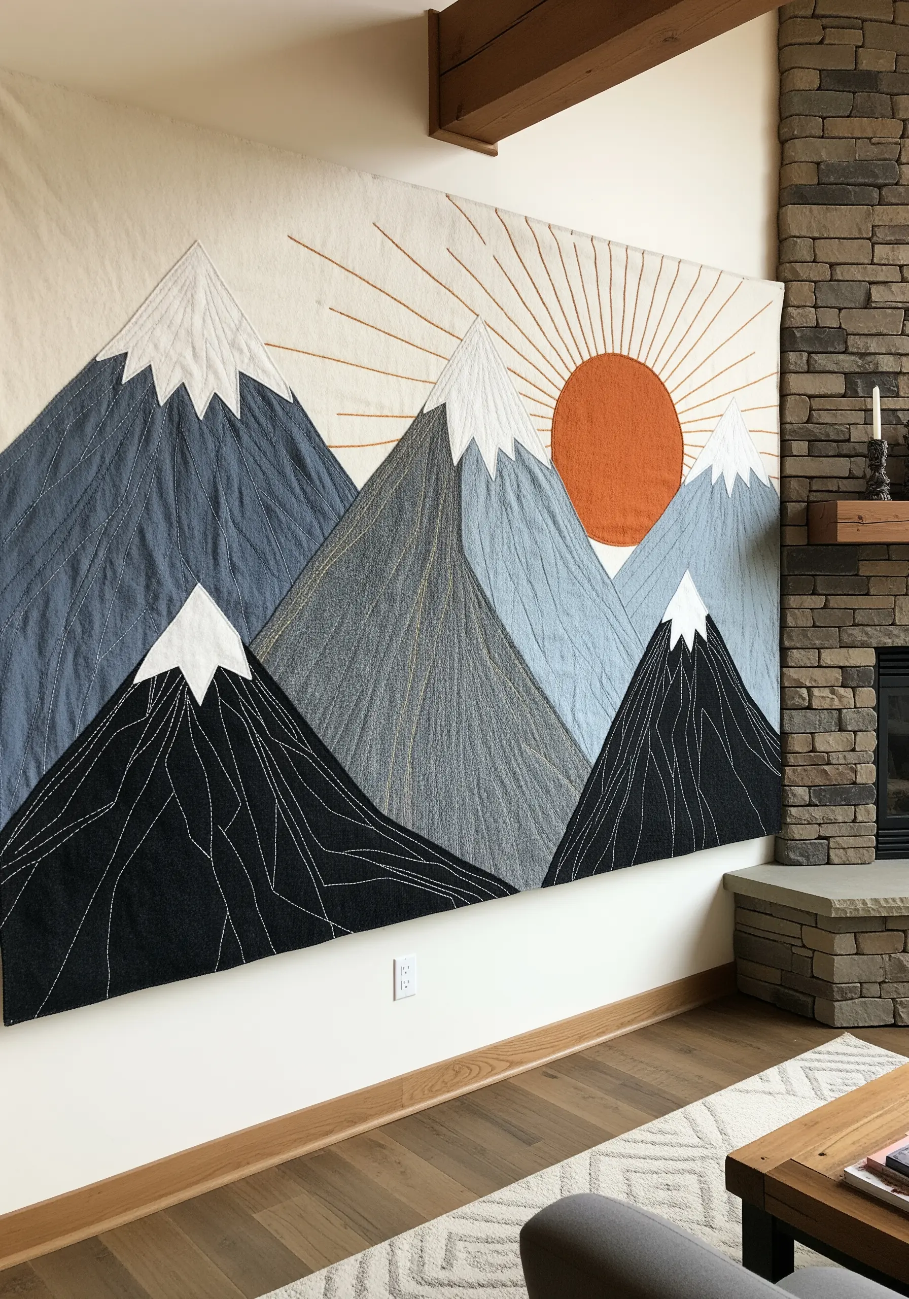 Large-scale fabric wall art of mountains with minimal stitched details.