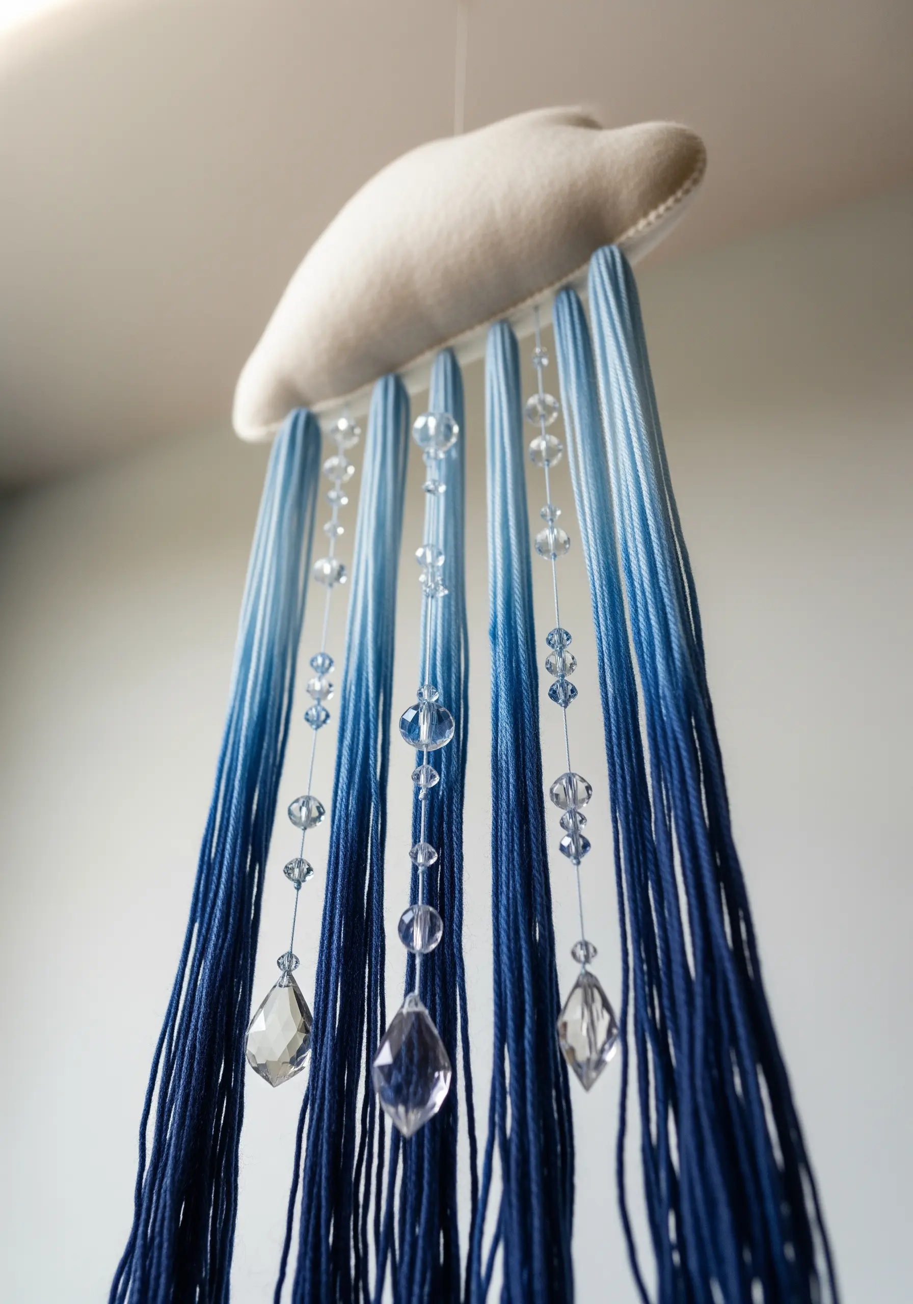 Felt cloud mobile with blue ombre yarn rain