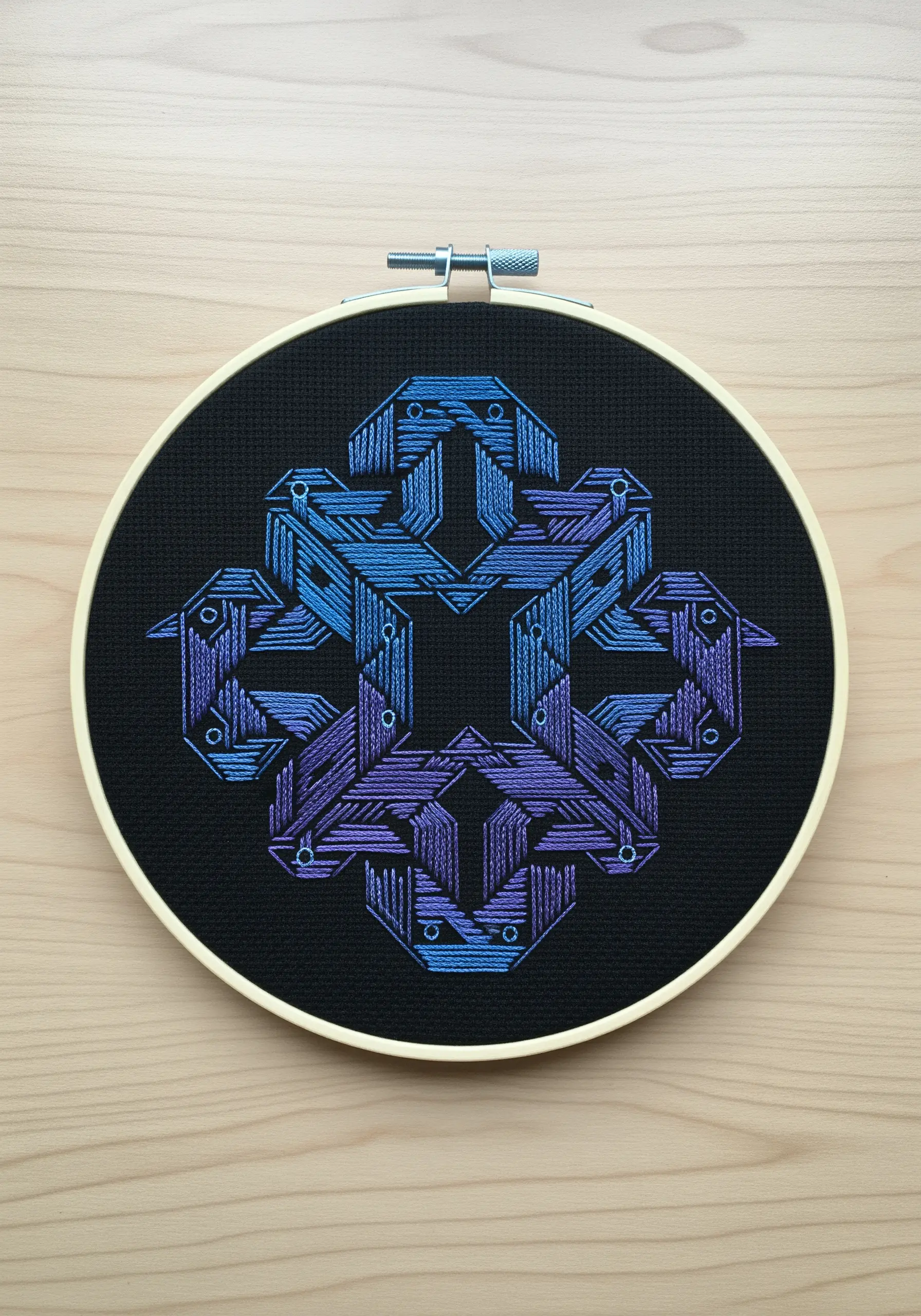 Intricate geometric illusion pattern with blue and purple gradient satin stitch.