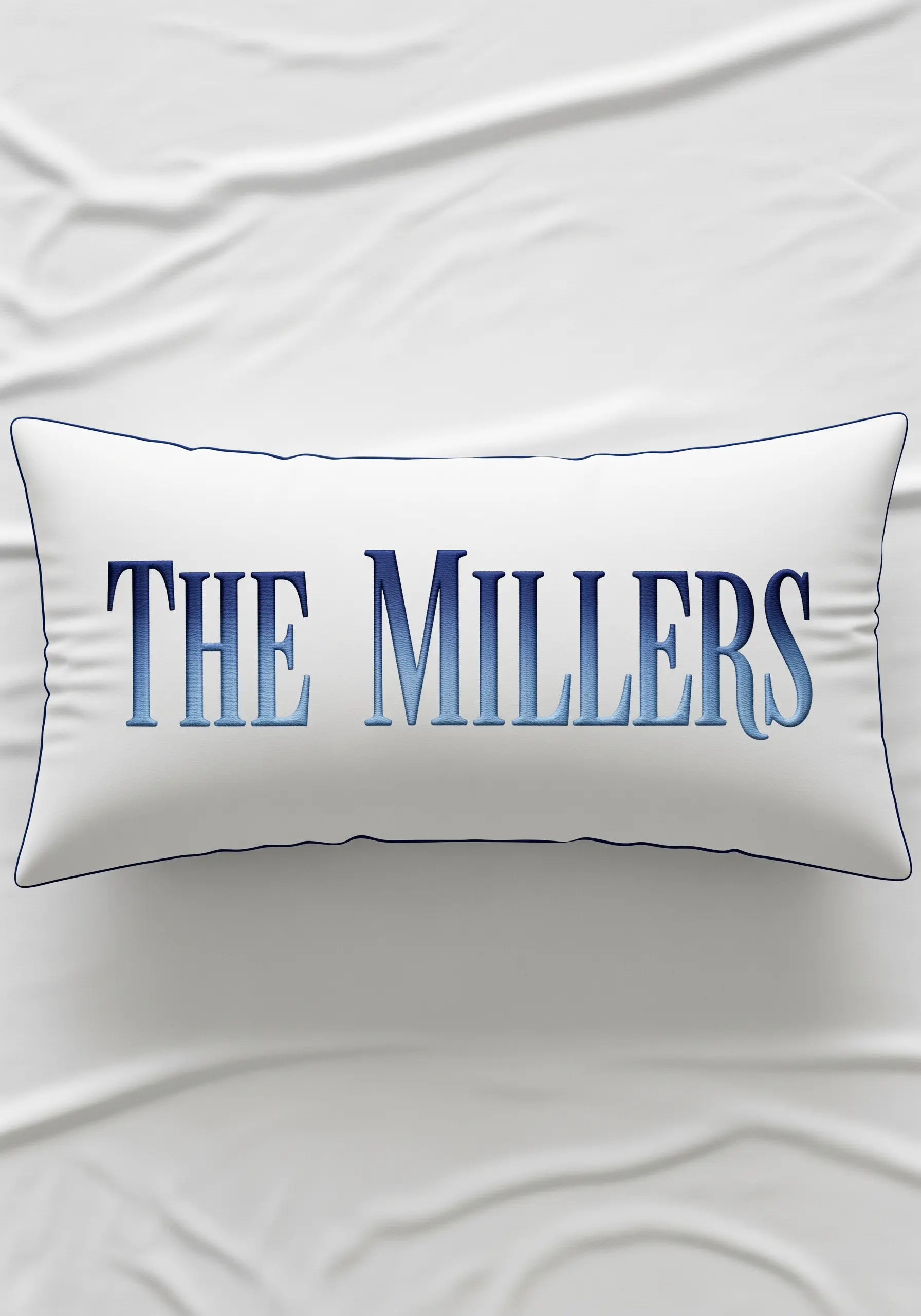 White lumbar pillow with blue gradient ombre embroidery The Millers