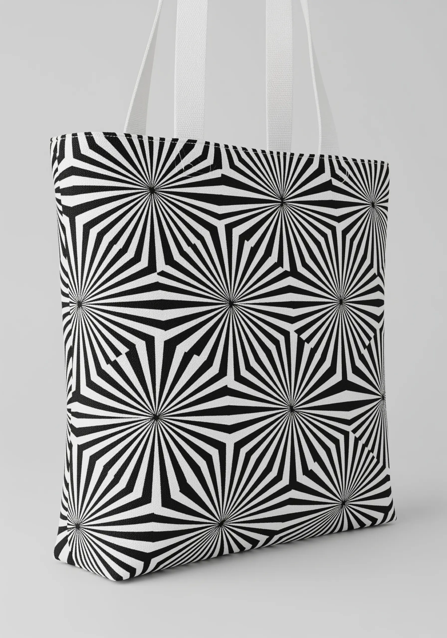 A high-contrast black-and-white geometric pattern embroidered with dense fill stitches on a tote.