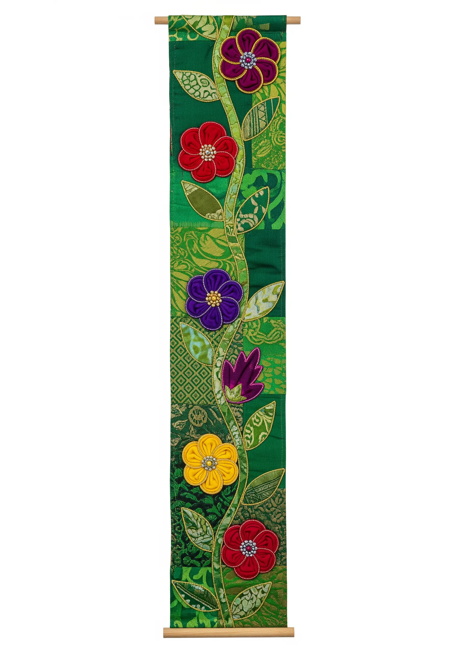 A tall green patchwork banner with an embroidered vine and colorful appliqué flowers.