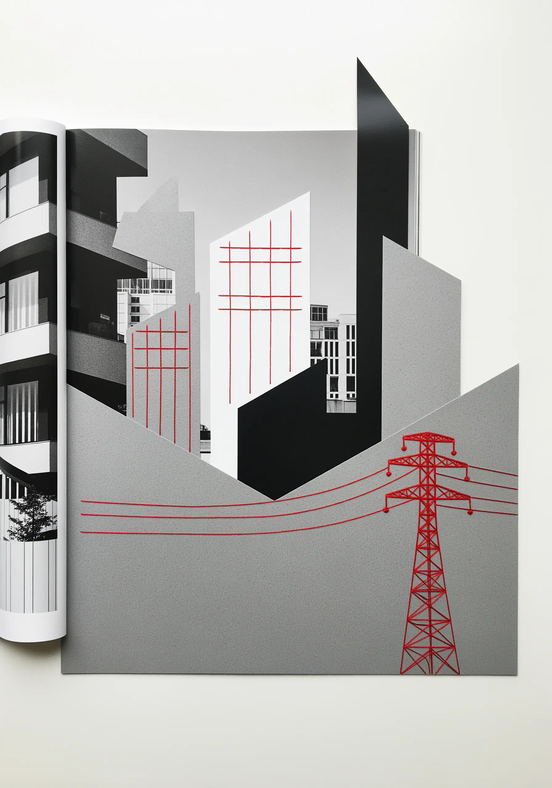 Minimalist red thread embroidery creating architectural lines on a grayscale paper collage.