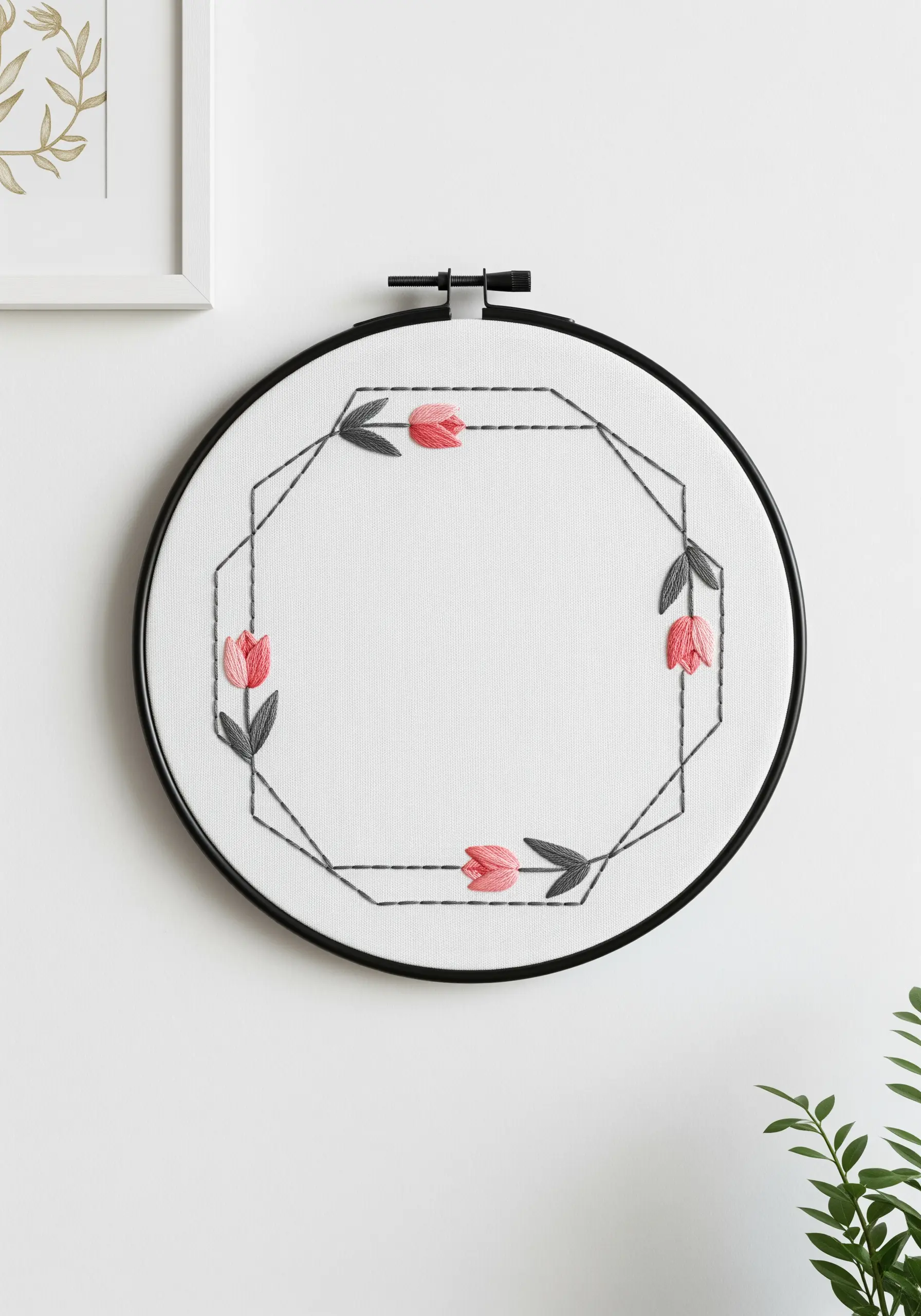 Minimalist geometric octagon frame with stylized pink satin-stitched tulips and dark leaves.
