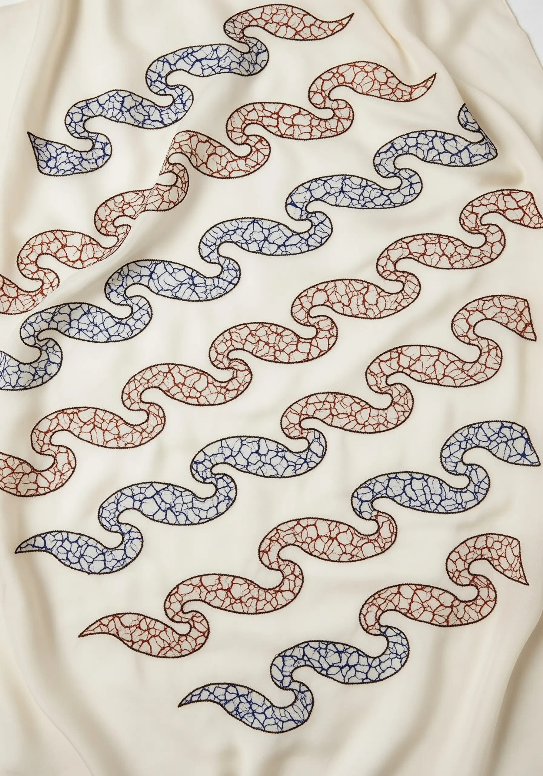 A repeating Japanese Seigaiha wave pattern embroidered with a crackle-texture fill.