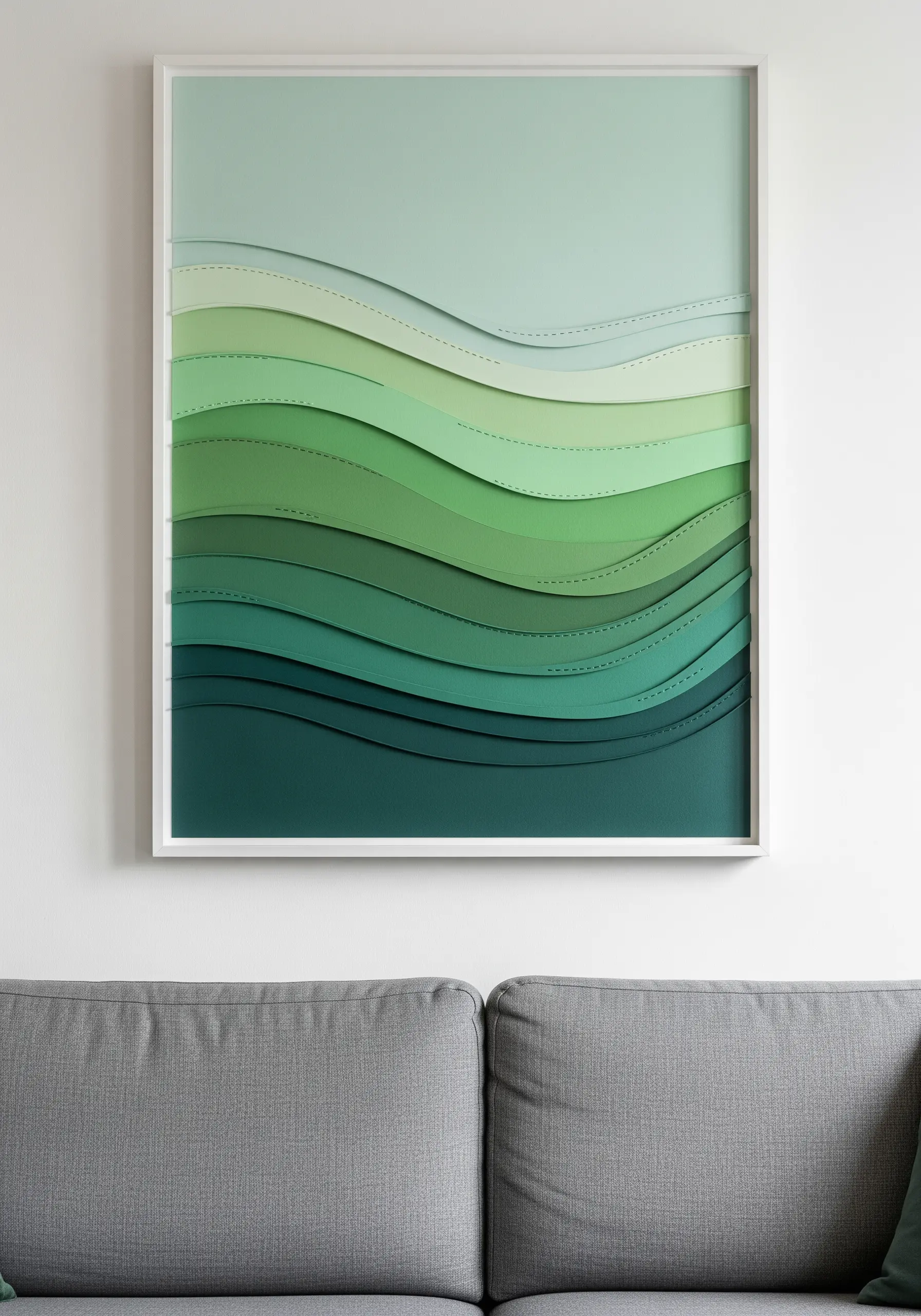A framed wall art piece with layered waves of green faux leather in a gradient.
