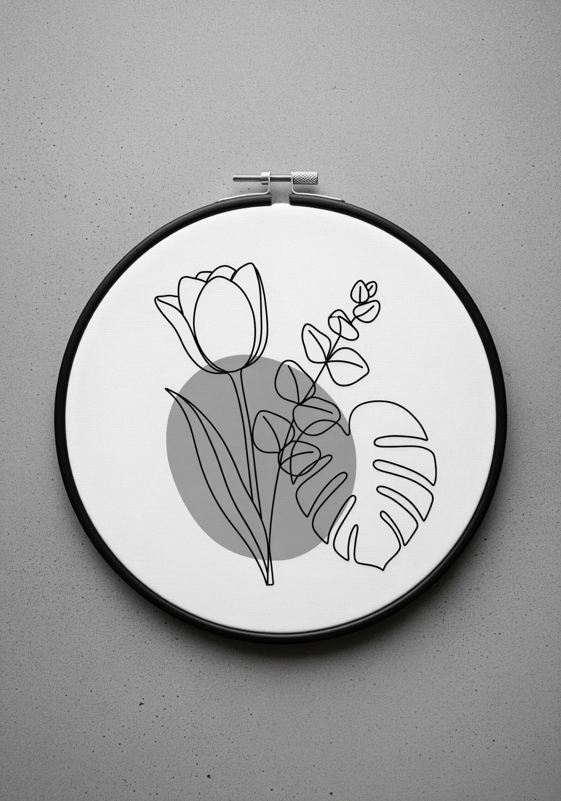 Black line art embroidery of a tulip and leaves layered over a gray circle in a black hoop.