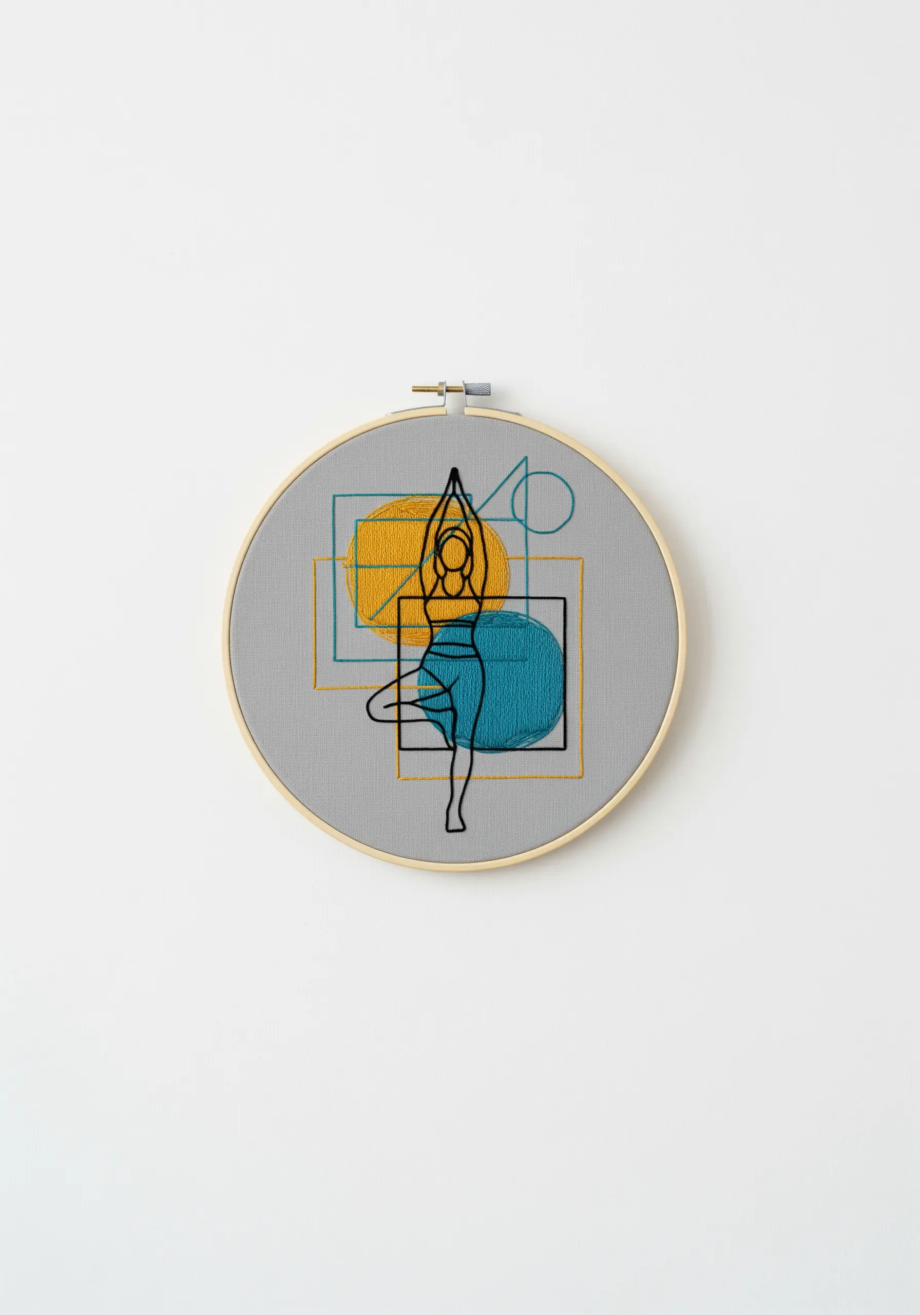 A line art yoga figure stitched over abstract blocks of teal and yellow embroidery.