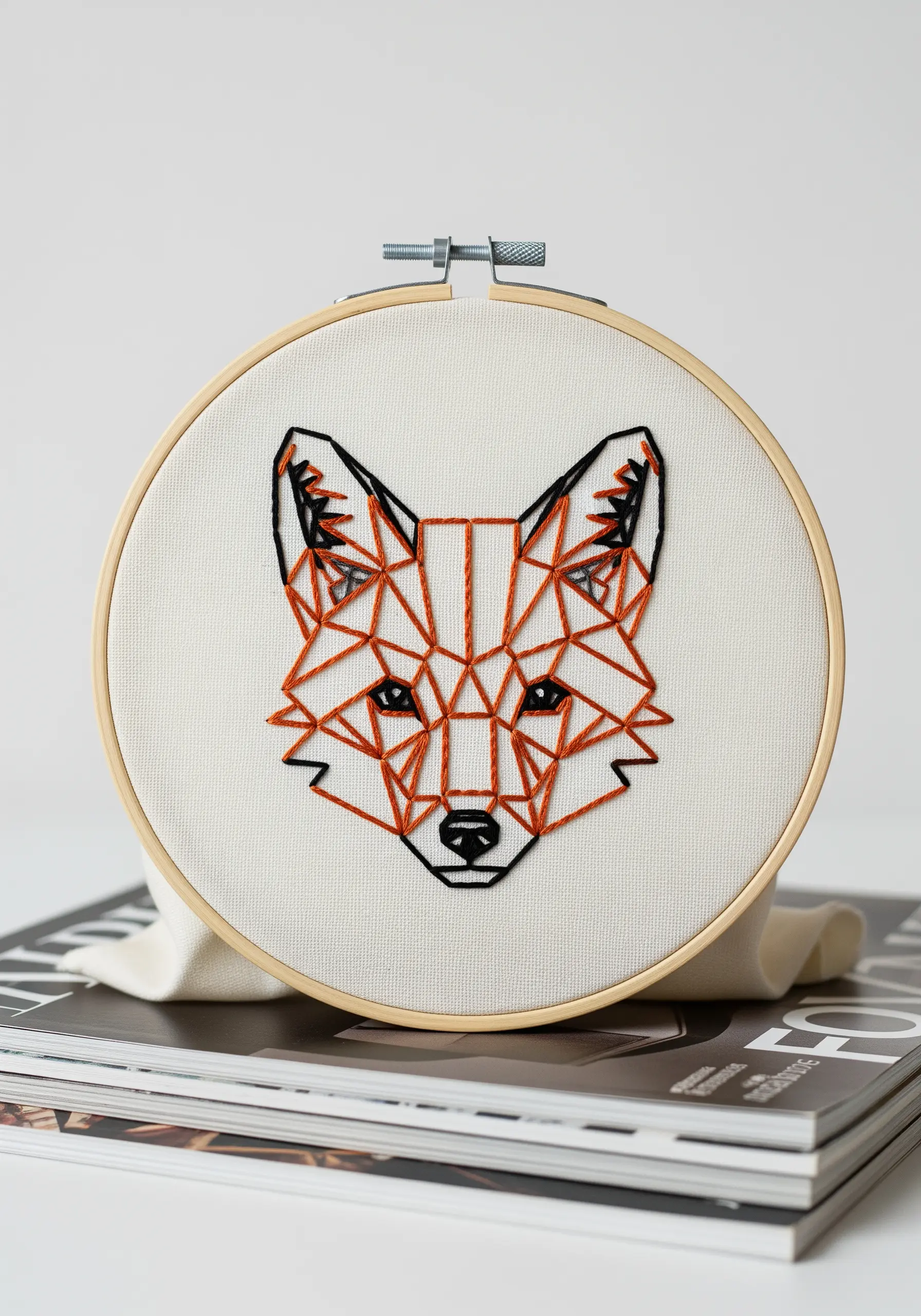 Geometric low-poly fox embroidery with orange and black lines