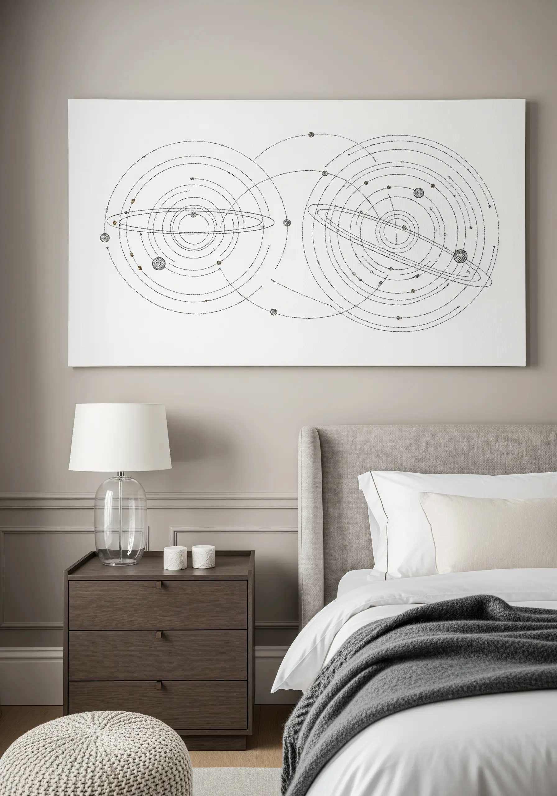 A large, technical line-art embroidery of planetary orbits above a bed.