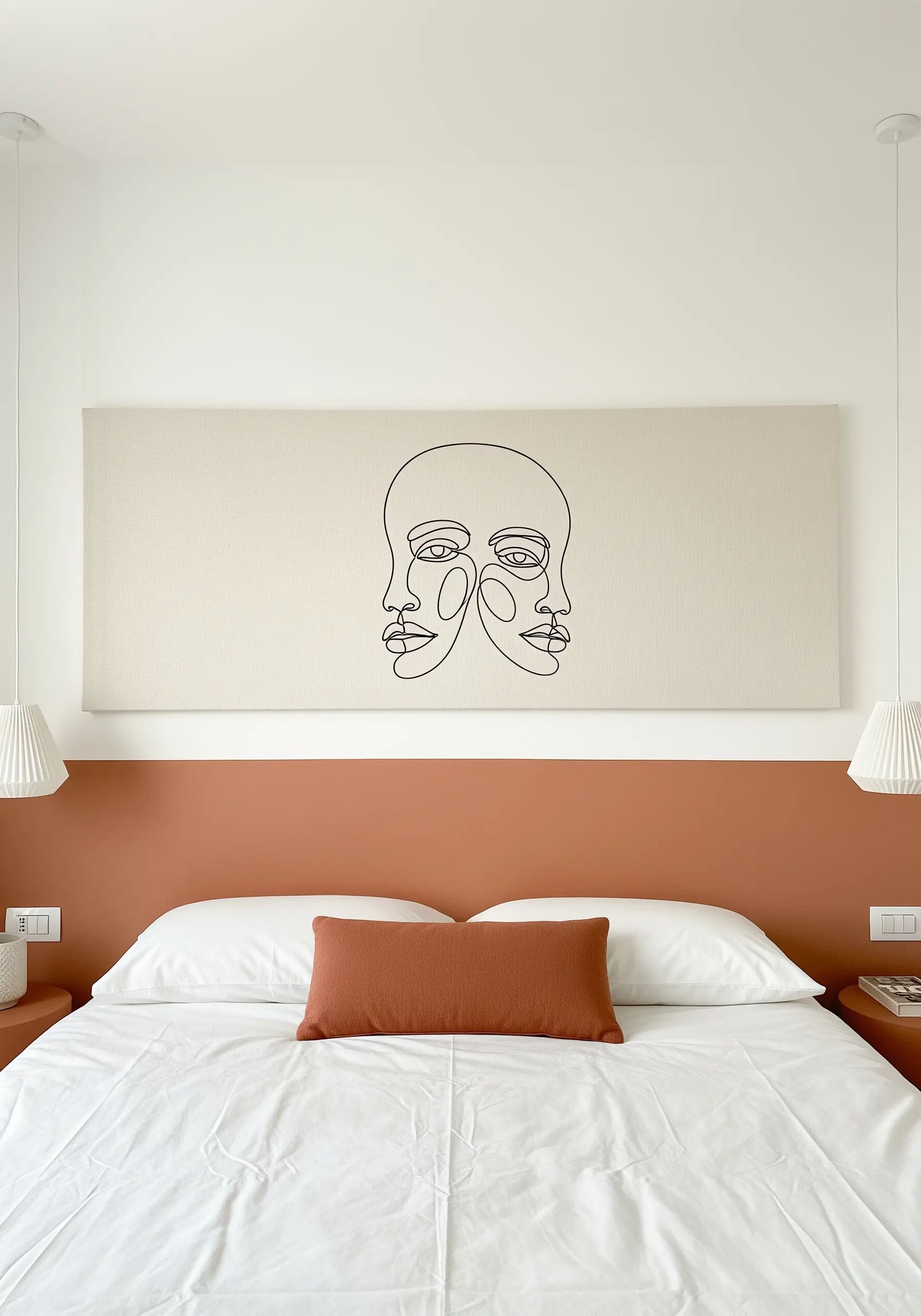 A minimal single-line art portrait stitched in black thread on a wide canvas headboard.