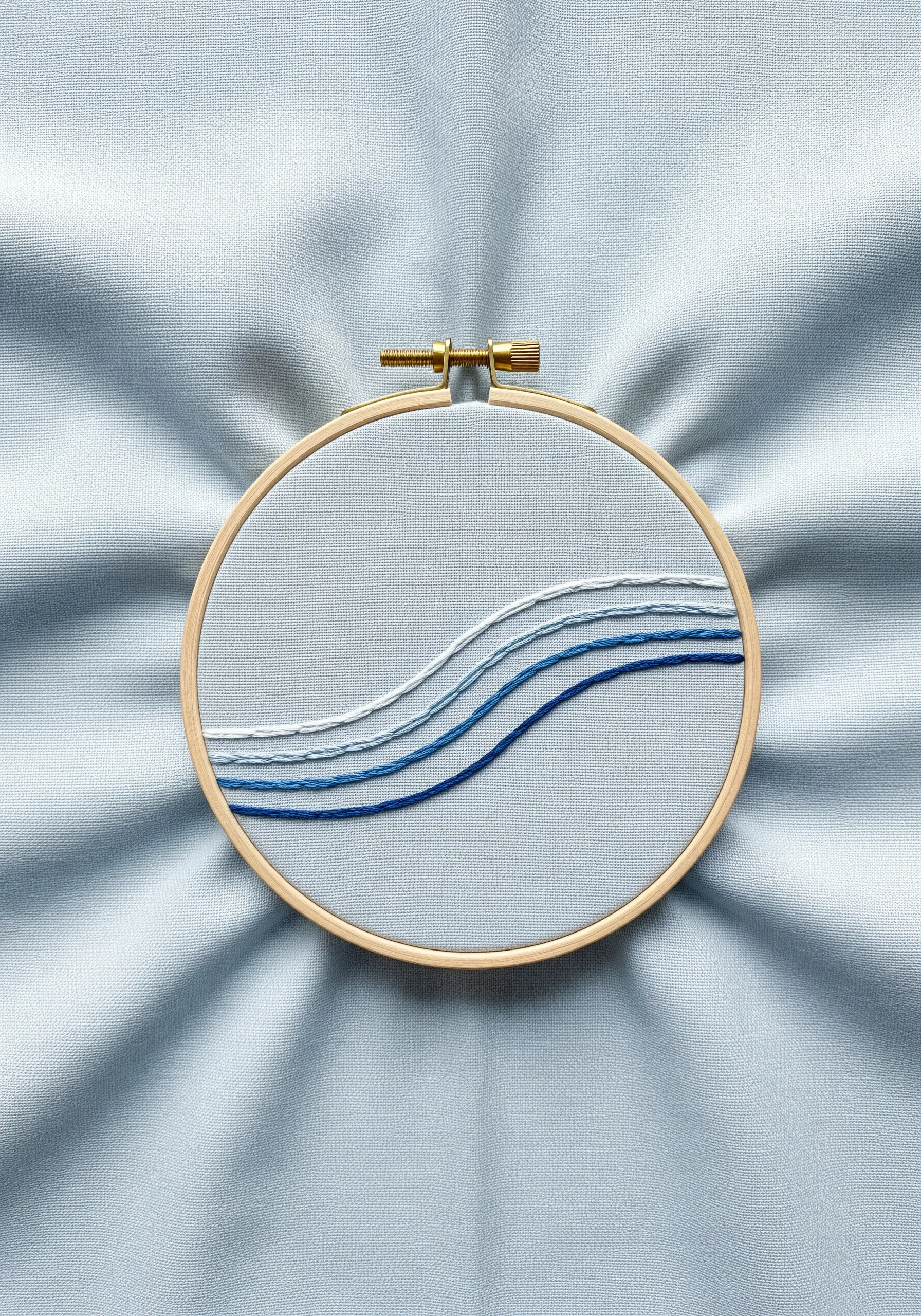 Minimalist abstract waves embroidered with parallel lines in a blue color gradient.