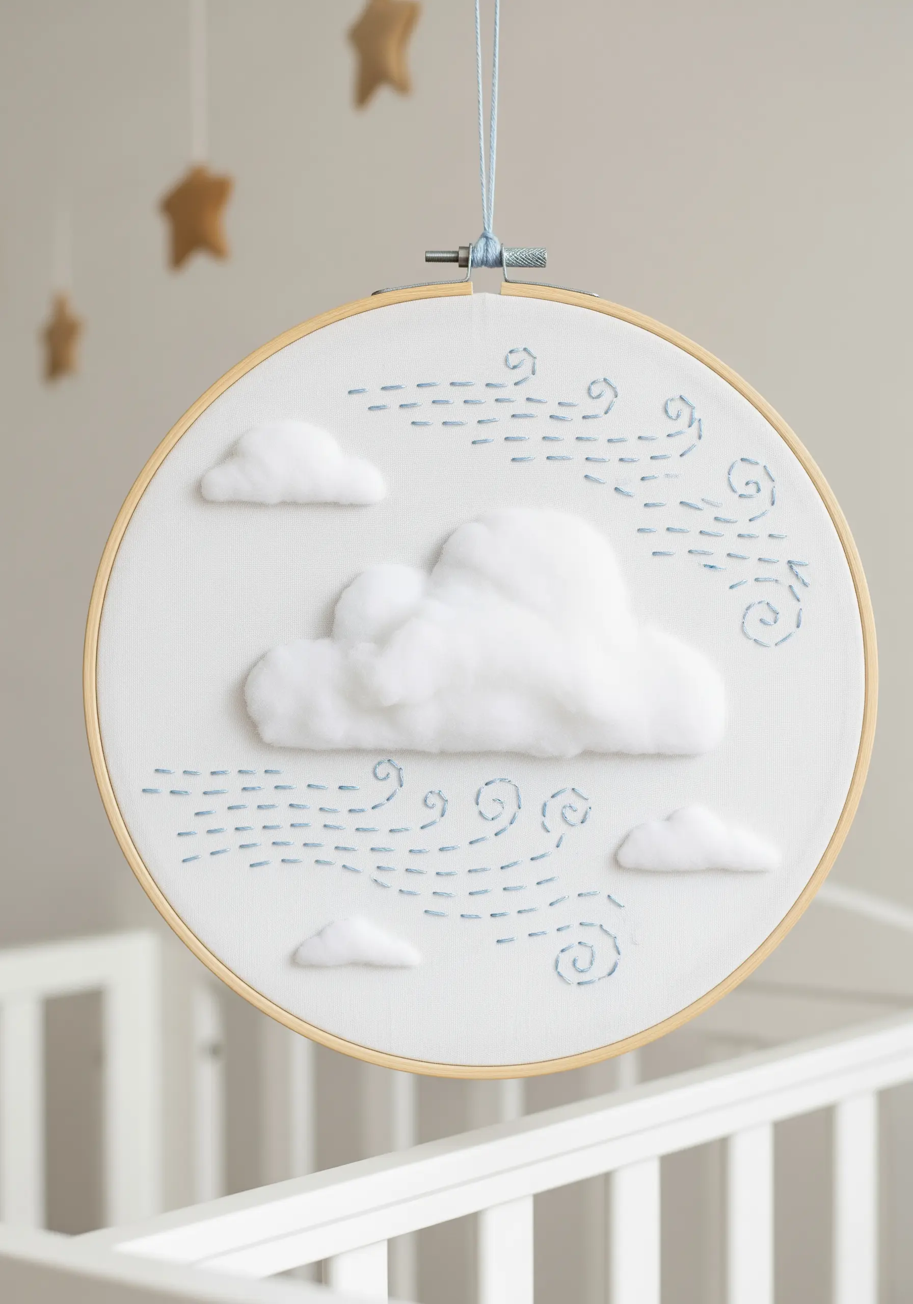 Embroidery hoop with blue wind stitches and 3D cotton cloud