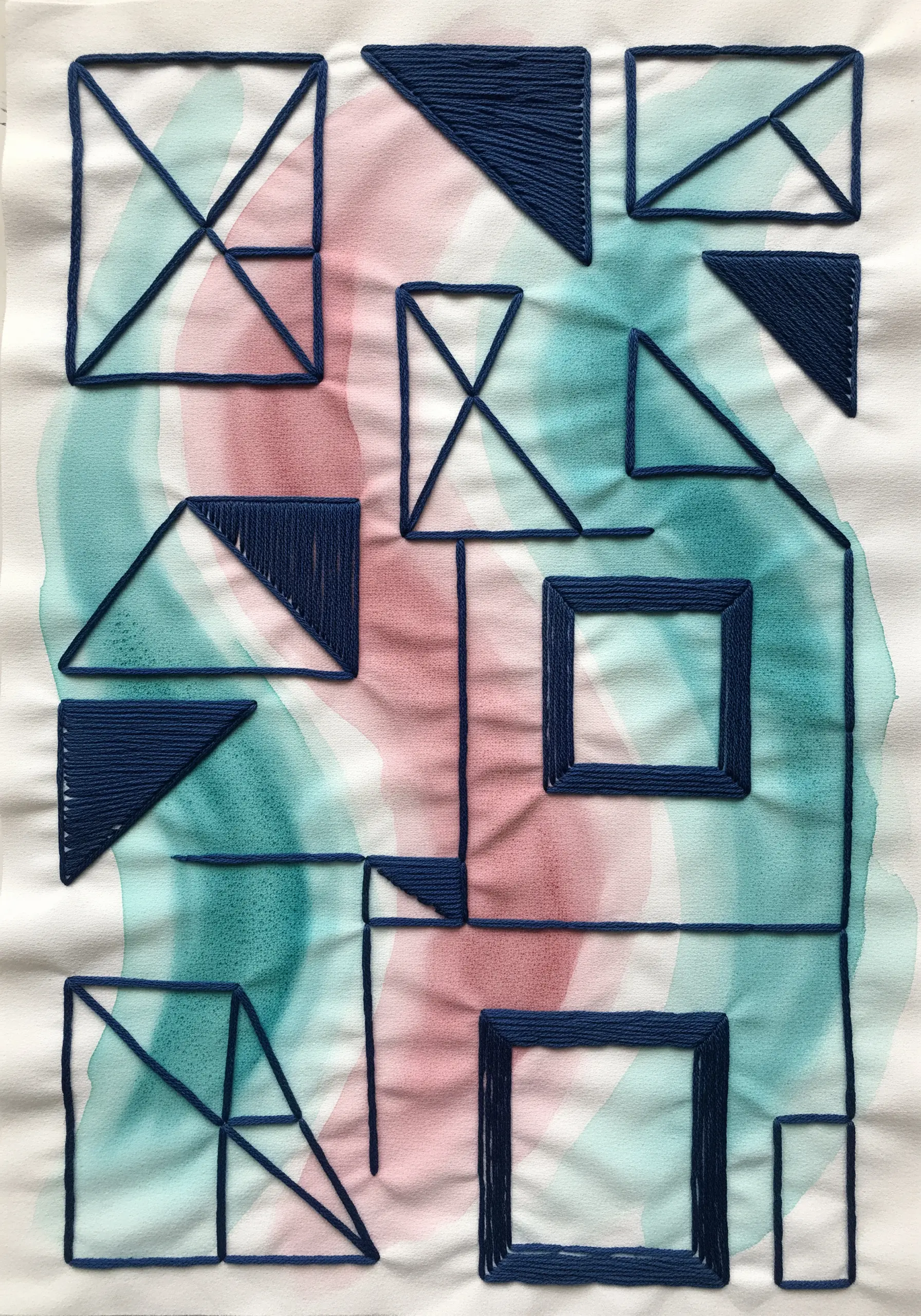 Geometric embroidery lines over abstract watercolor wash background