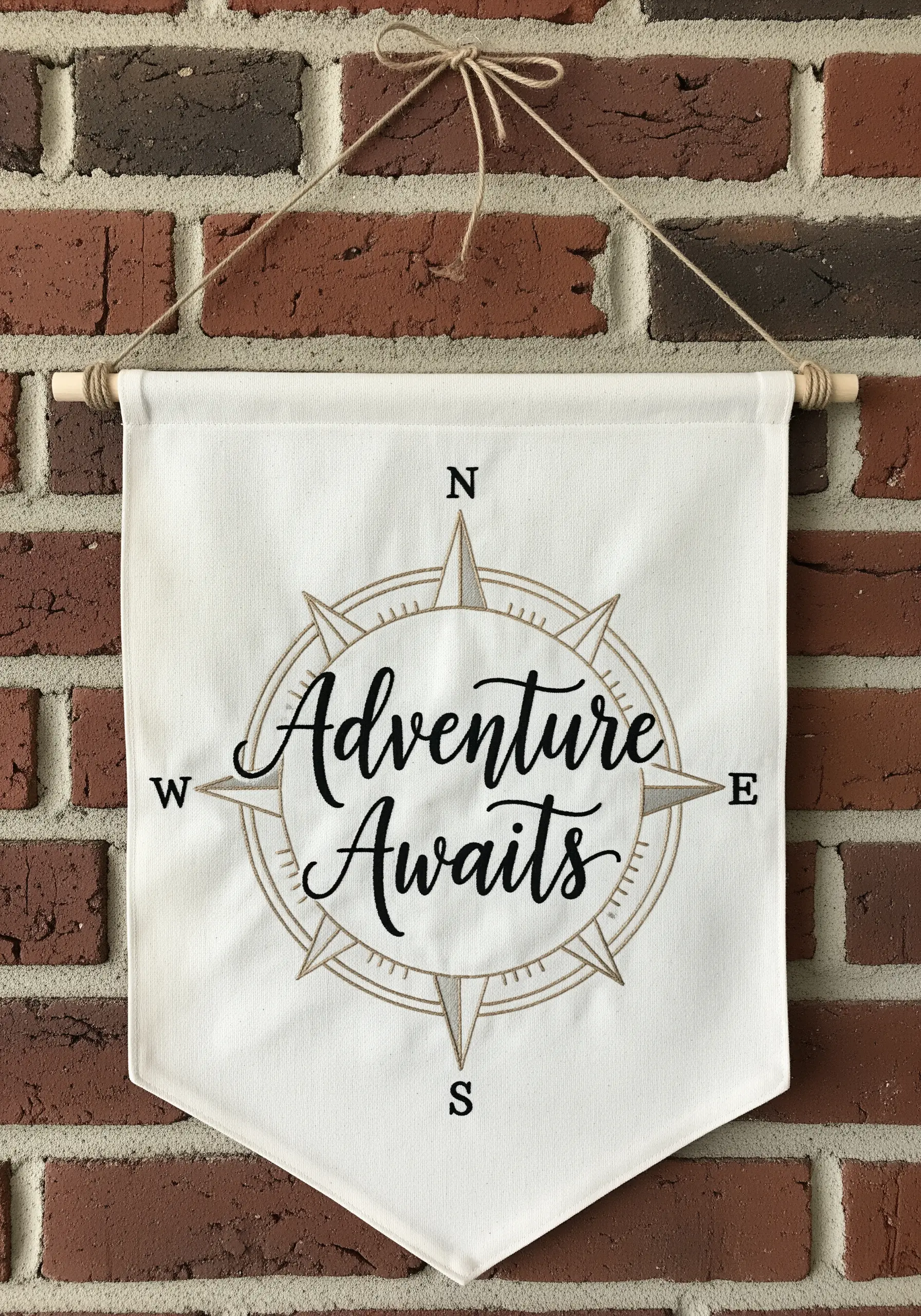 Fabric banner with compass and adventure quote