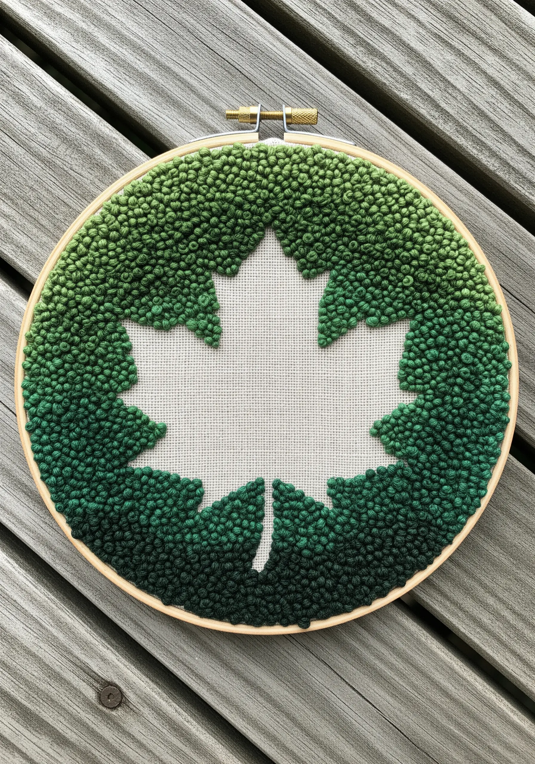 Maple leaf shape created by negative space surrounded by green knots