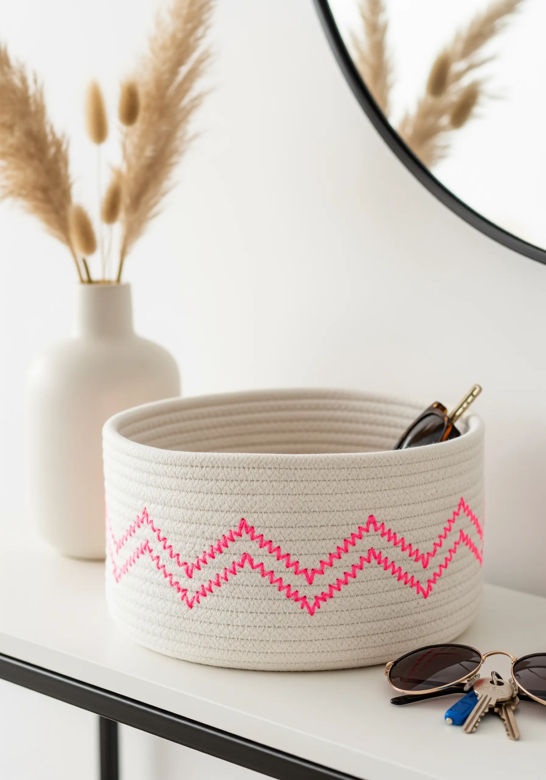 Coil rope basket with neon pink zigzag stitching
