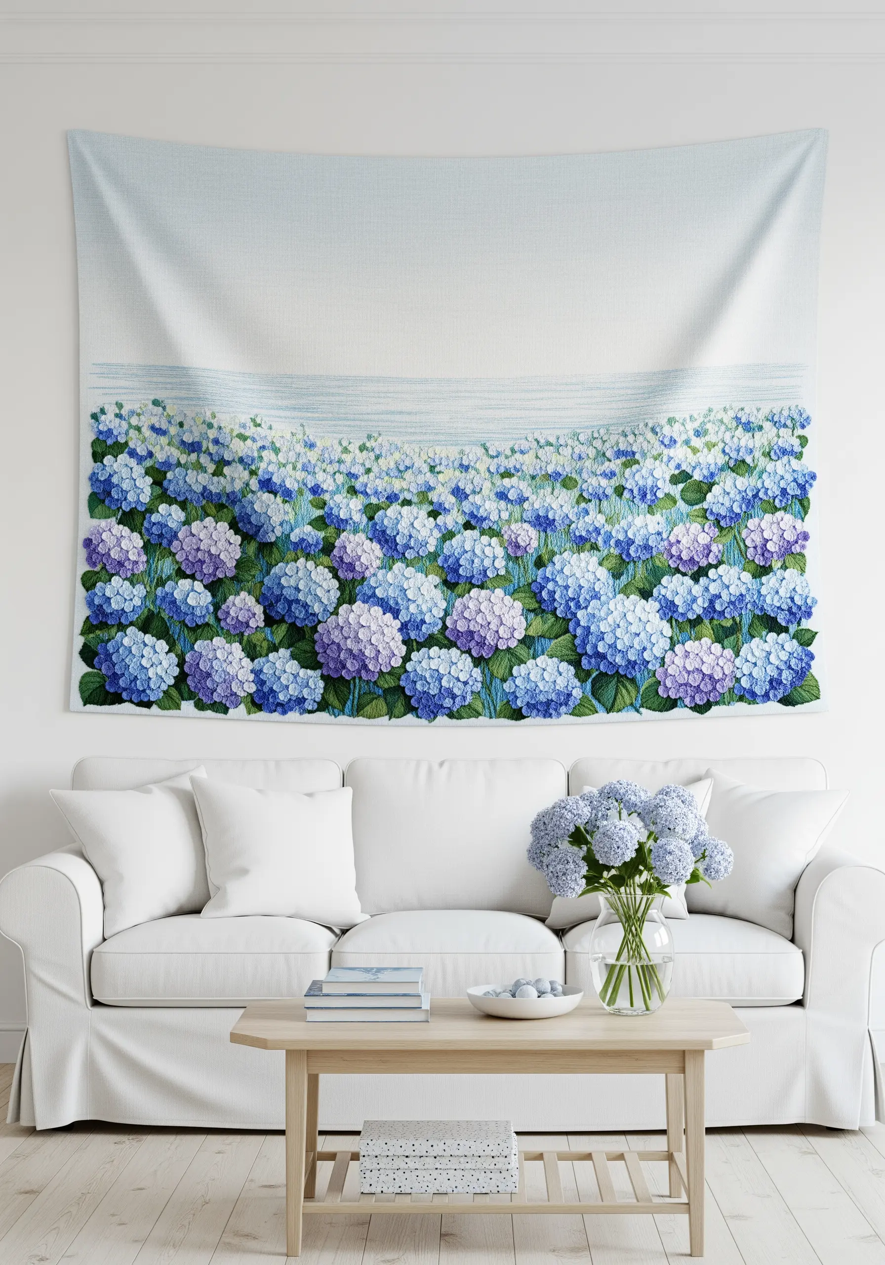A large embroidered wall tapestry depicting a vast field of blue and purple hydrangeas.