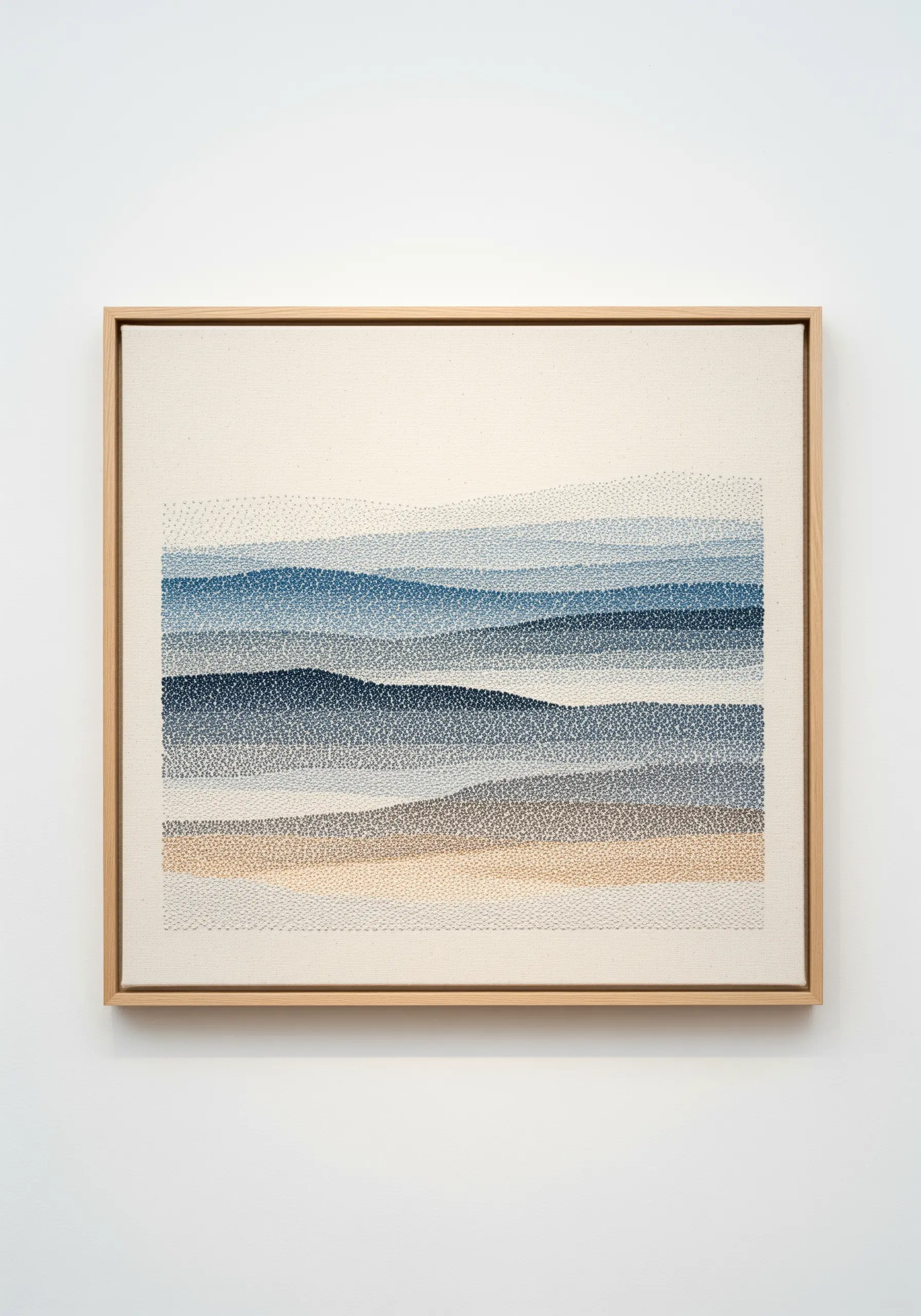 Abstract landscape embroidery made of dense seed stitches in blue and sand gradients.