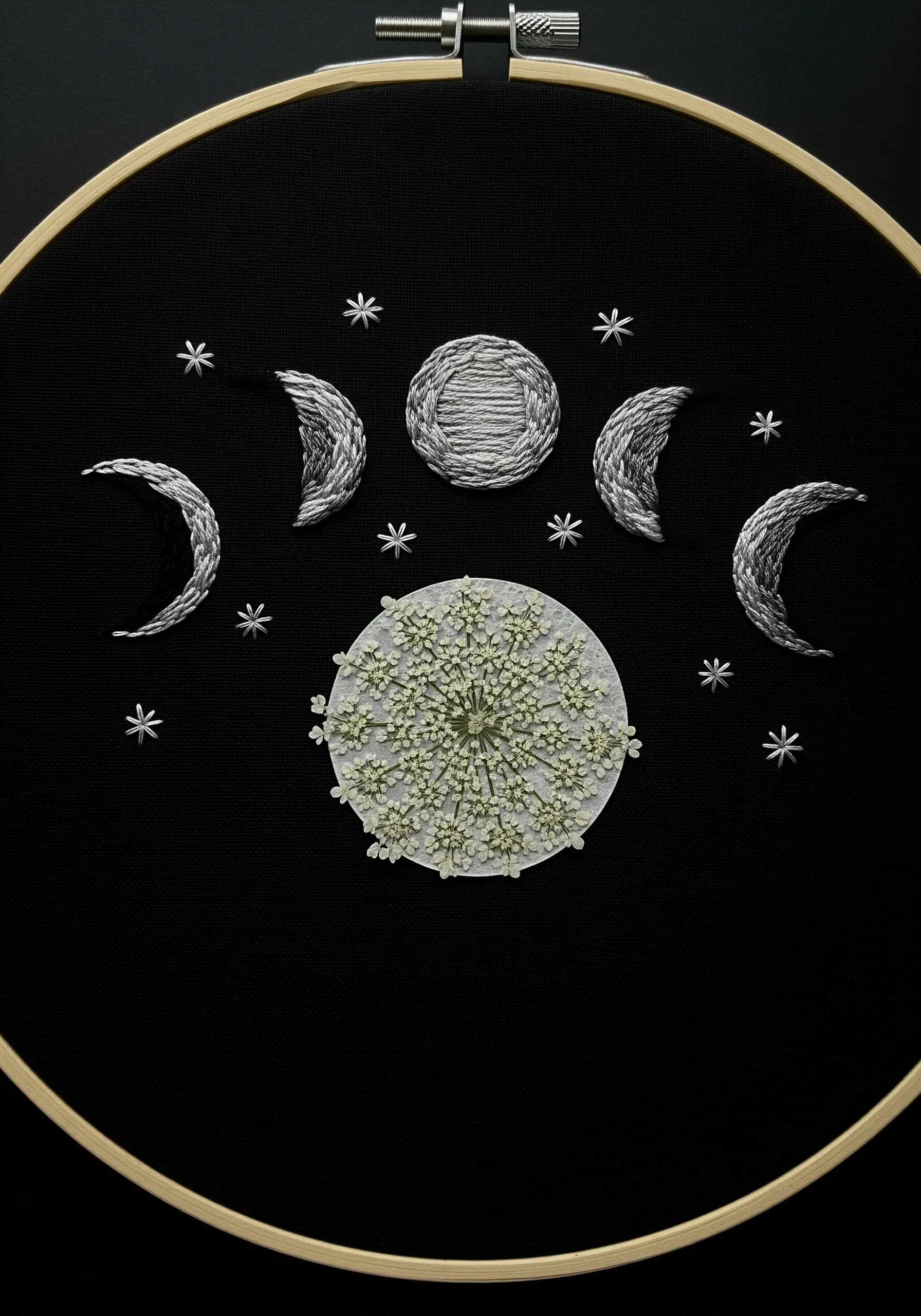 Moon phase embroidery with a pressed Queen Anne's Lace as the full moon.