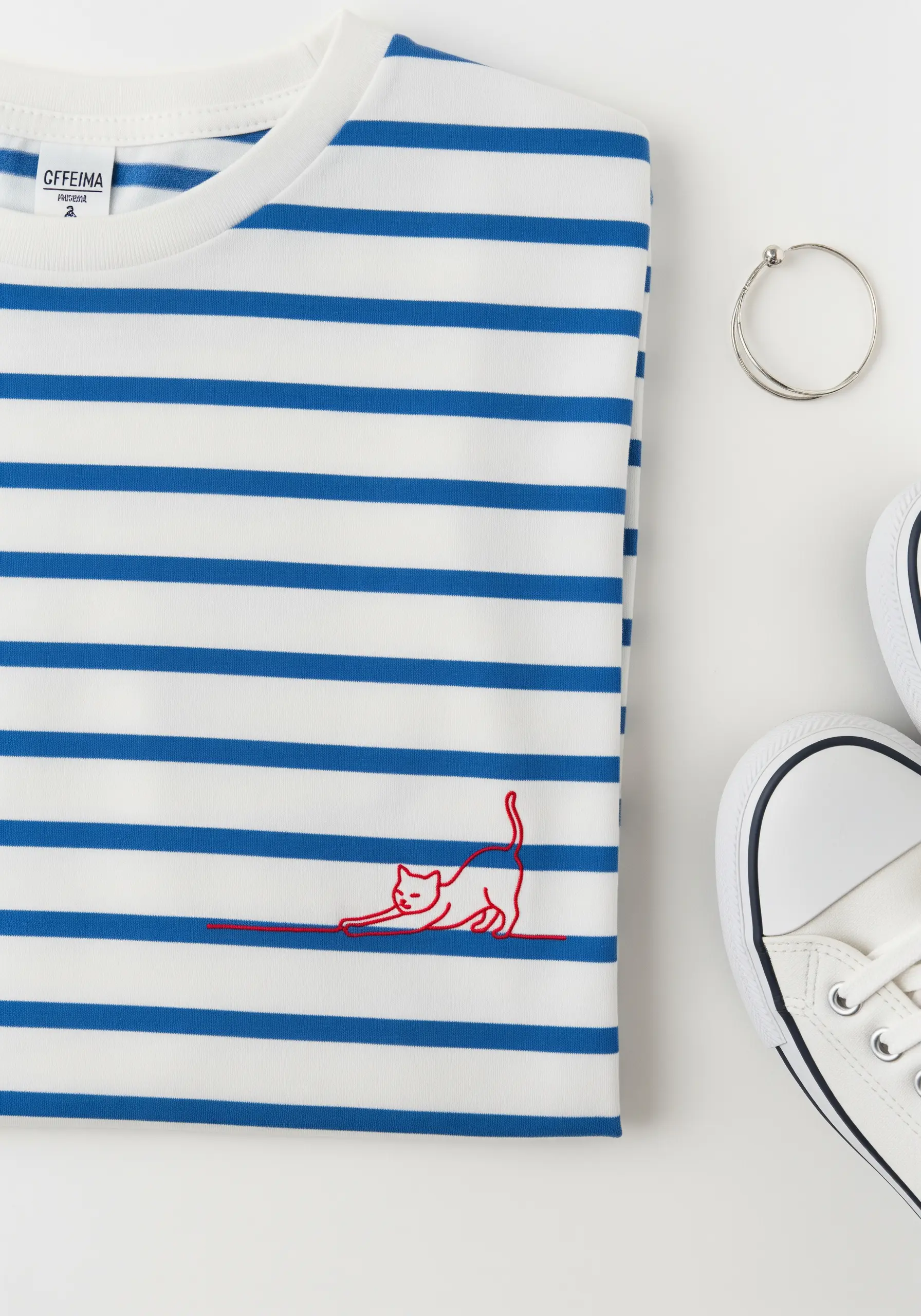 A red stretching cat embroidered on a blue and white striped t-shirt.