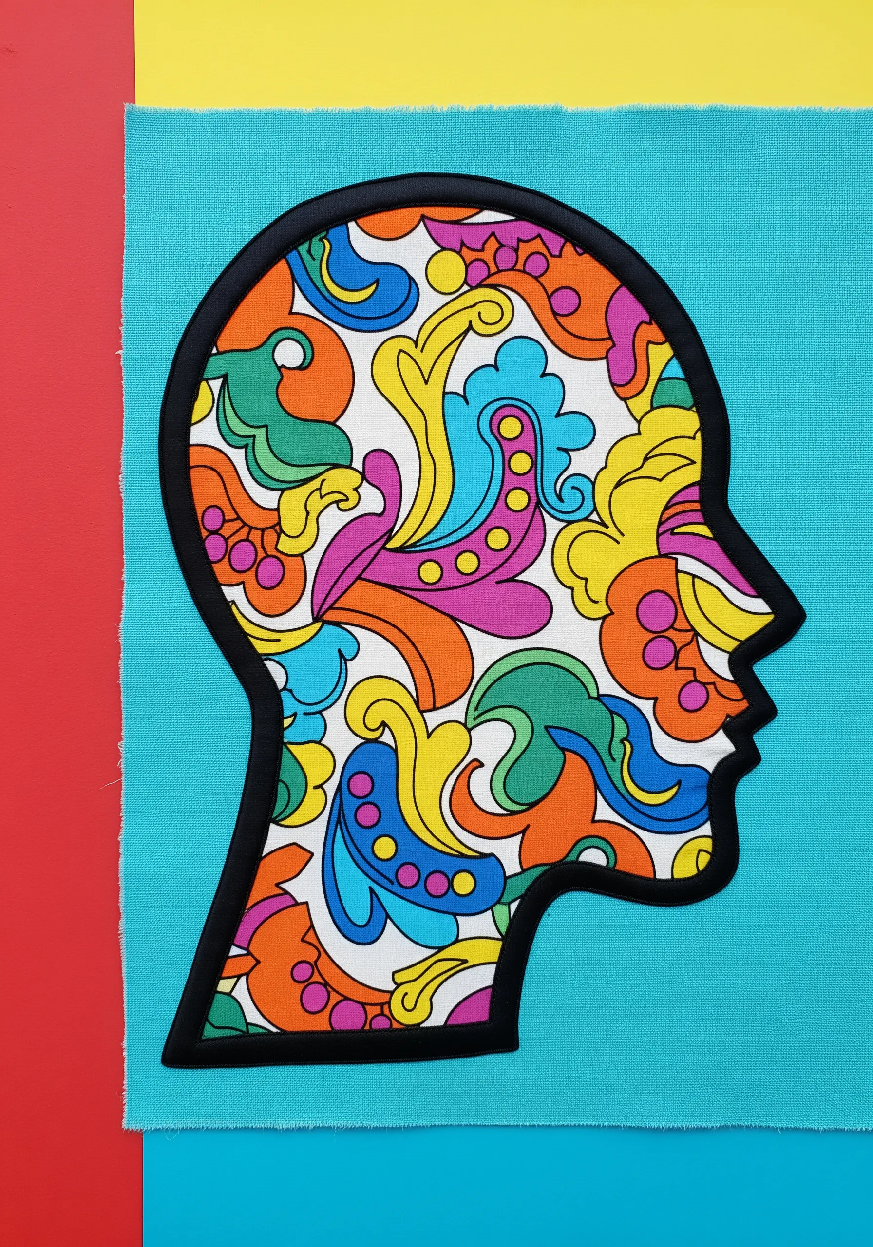 A pop art collage of a head silhouette filled with a vibrant, psychedelic pattern.