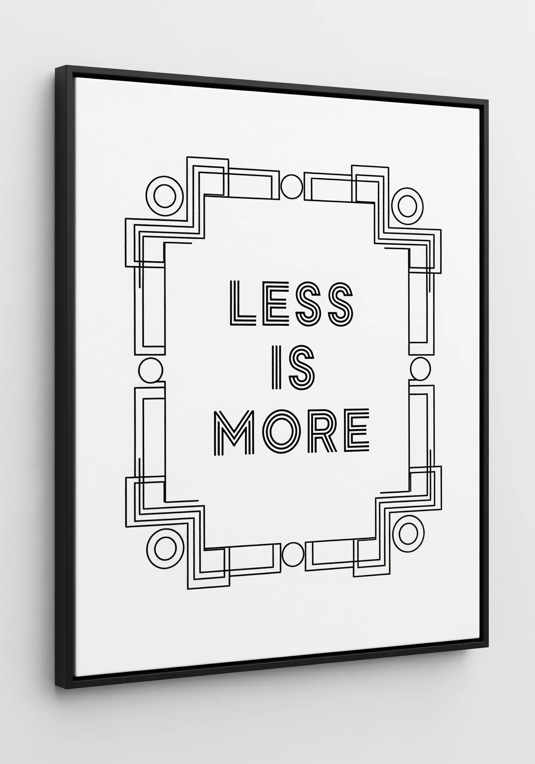 Art Deco-style geometric frame embroidered around the quote “Less is more.”