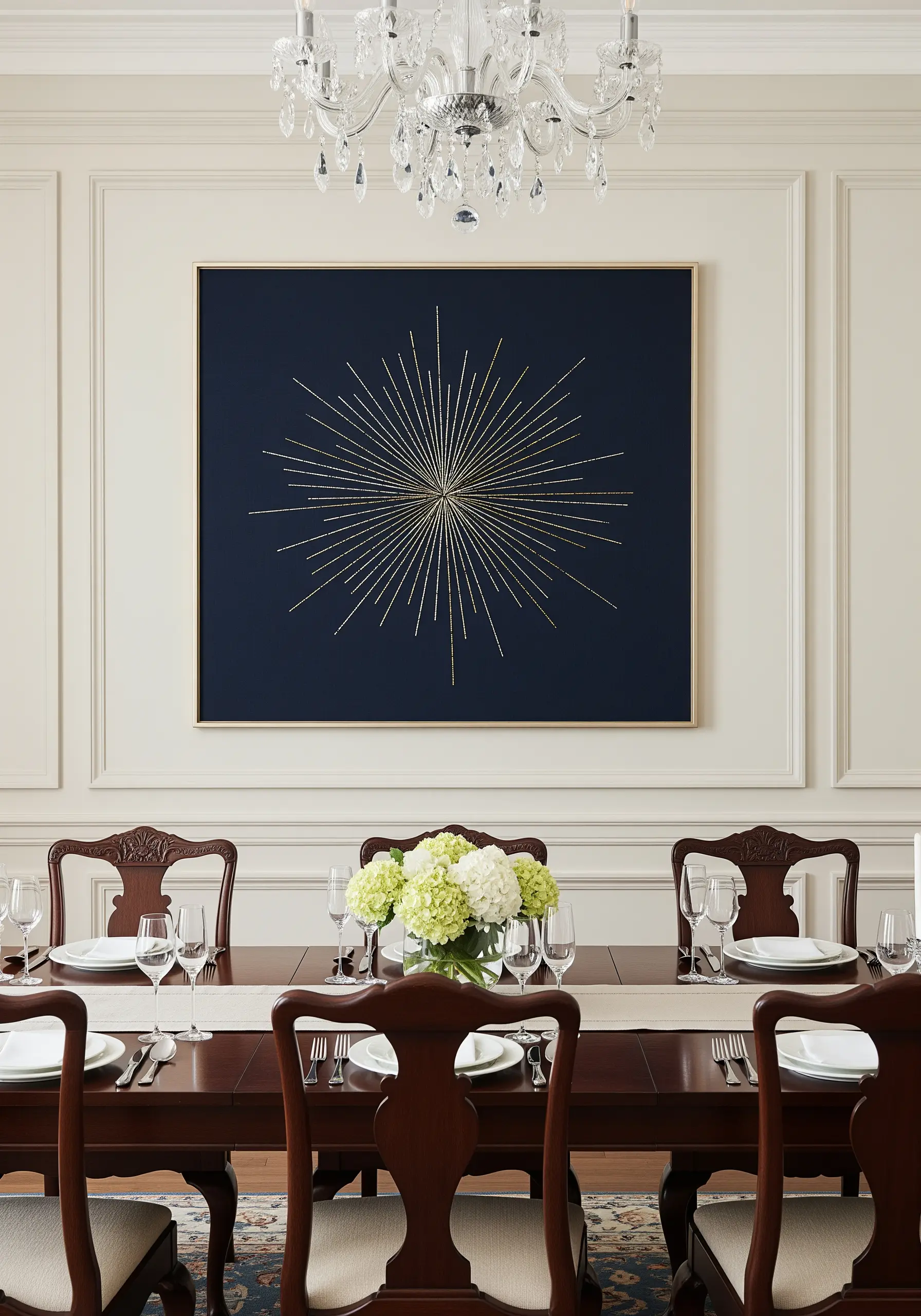 A large, framed starburst embroidered with gold thread on a dark navy blue background.