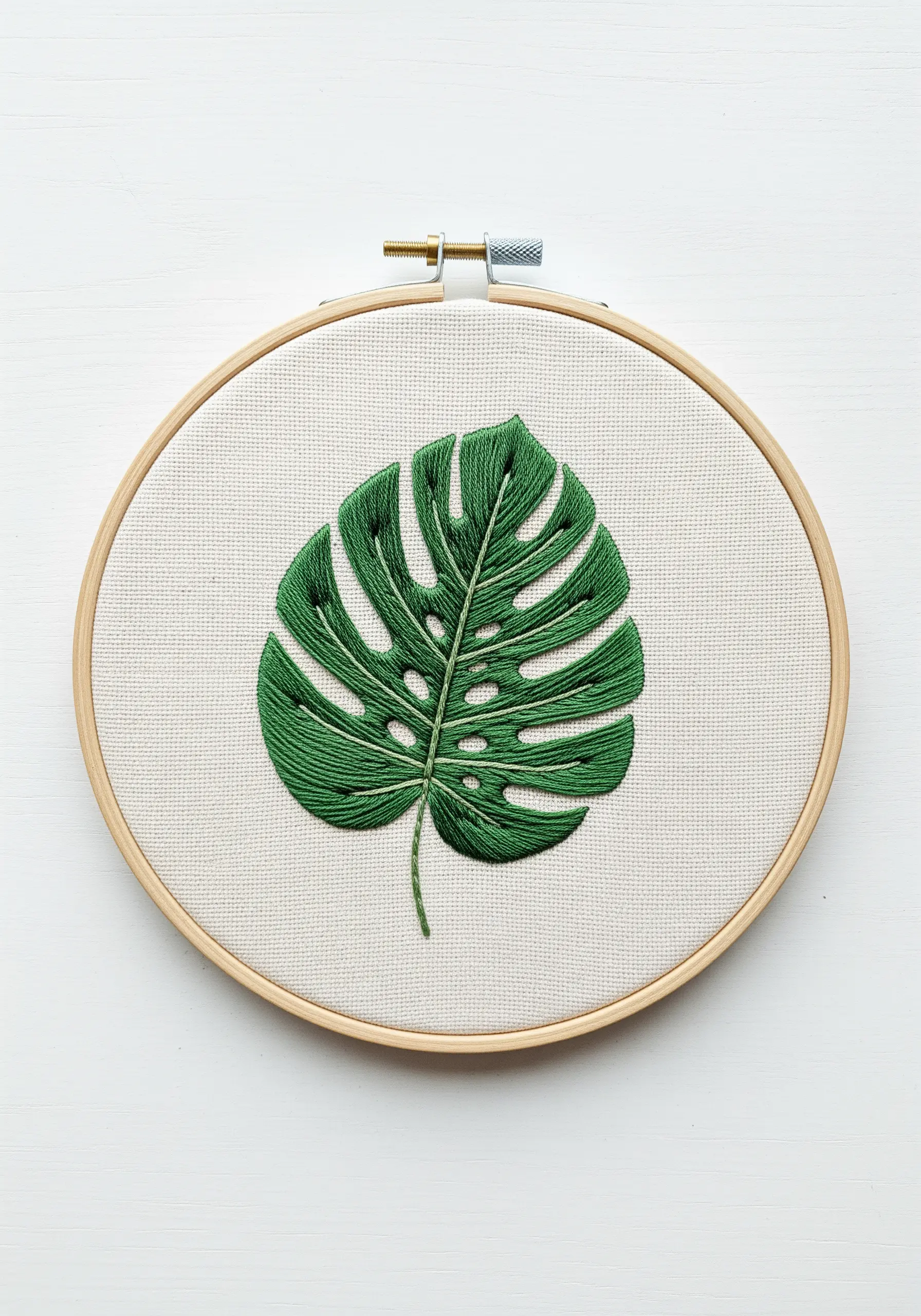Green monstera leaf embroidery using long and short stitch shading