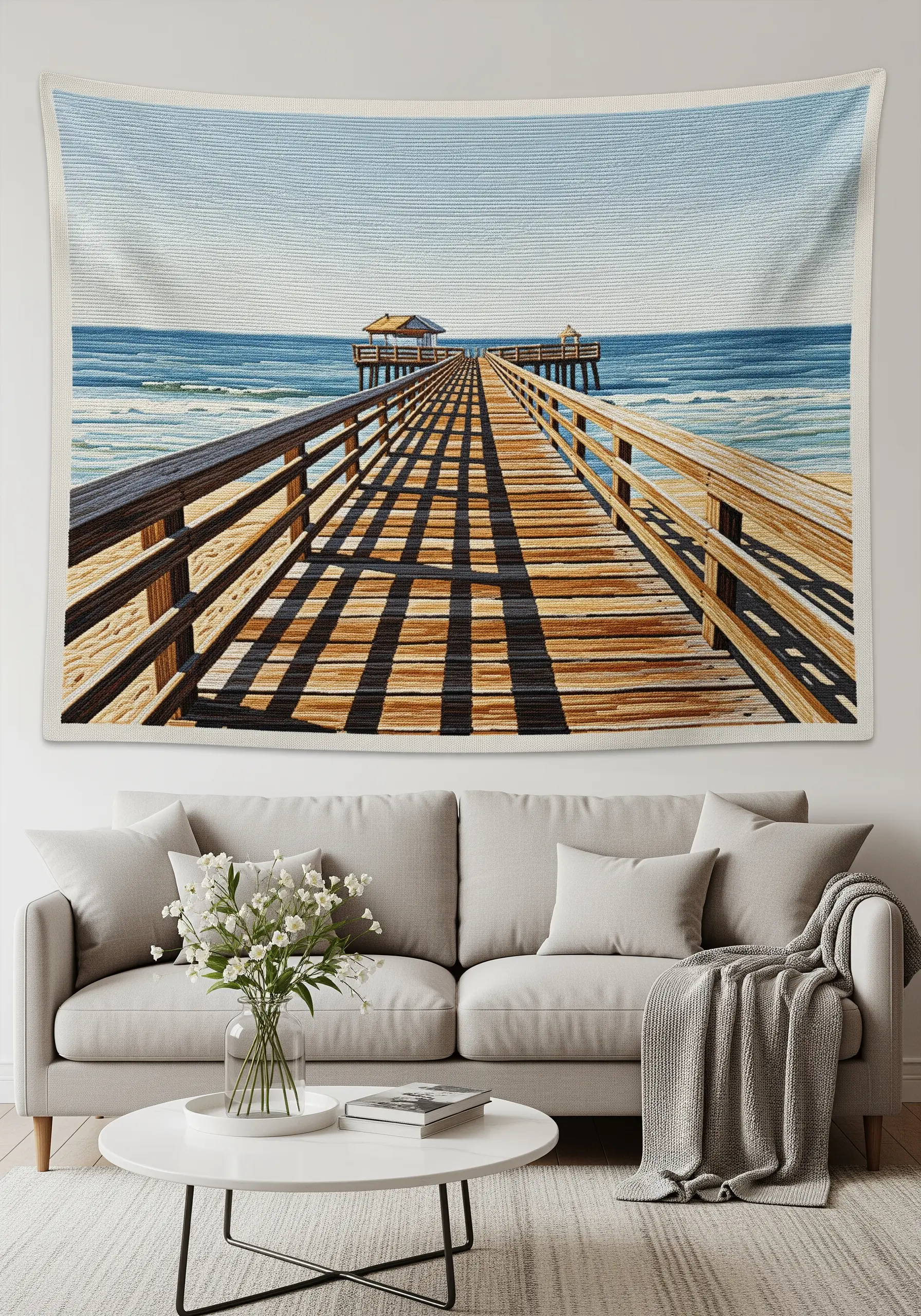 A large textile wall hanging depicting a long wooden pier stretching out to the ocean.