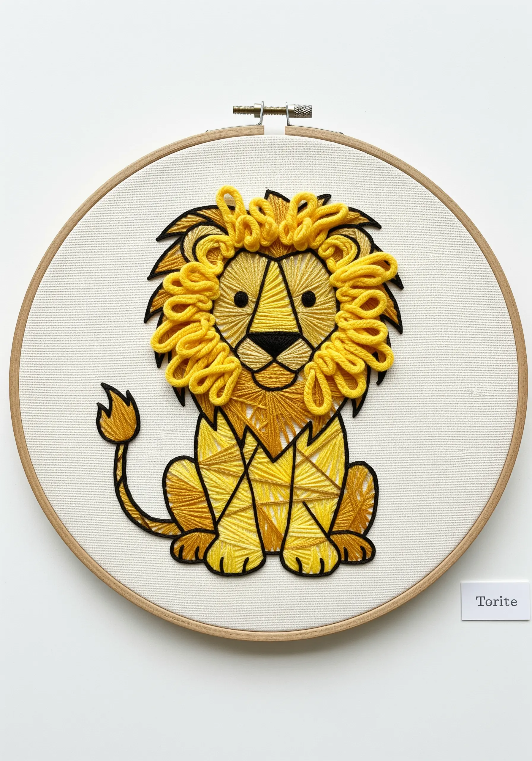 Embroidered lion with a three-dimensional yellow looped mane and a graphic black outline.