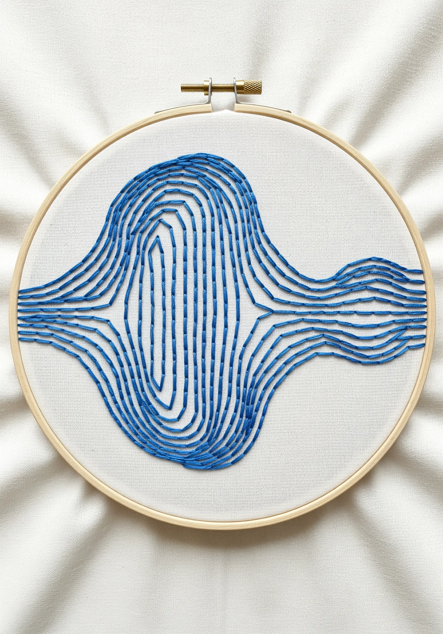 An abstract blue waveform made of vertical satin stitches on white fabric.