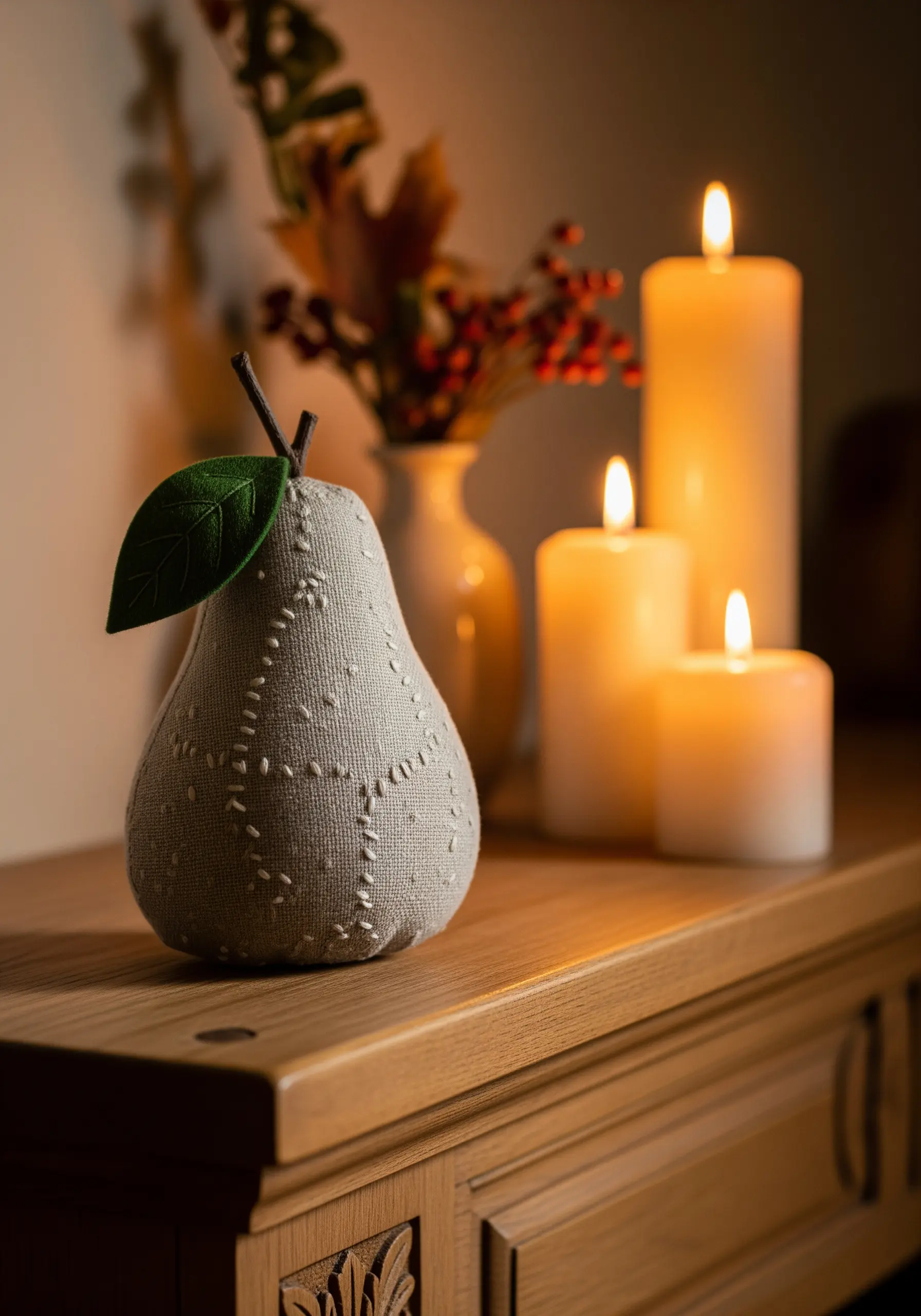 Fabric pear sculpture with white running stitch texture
