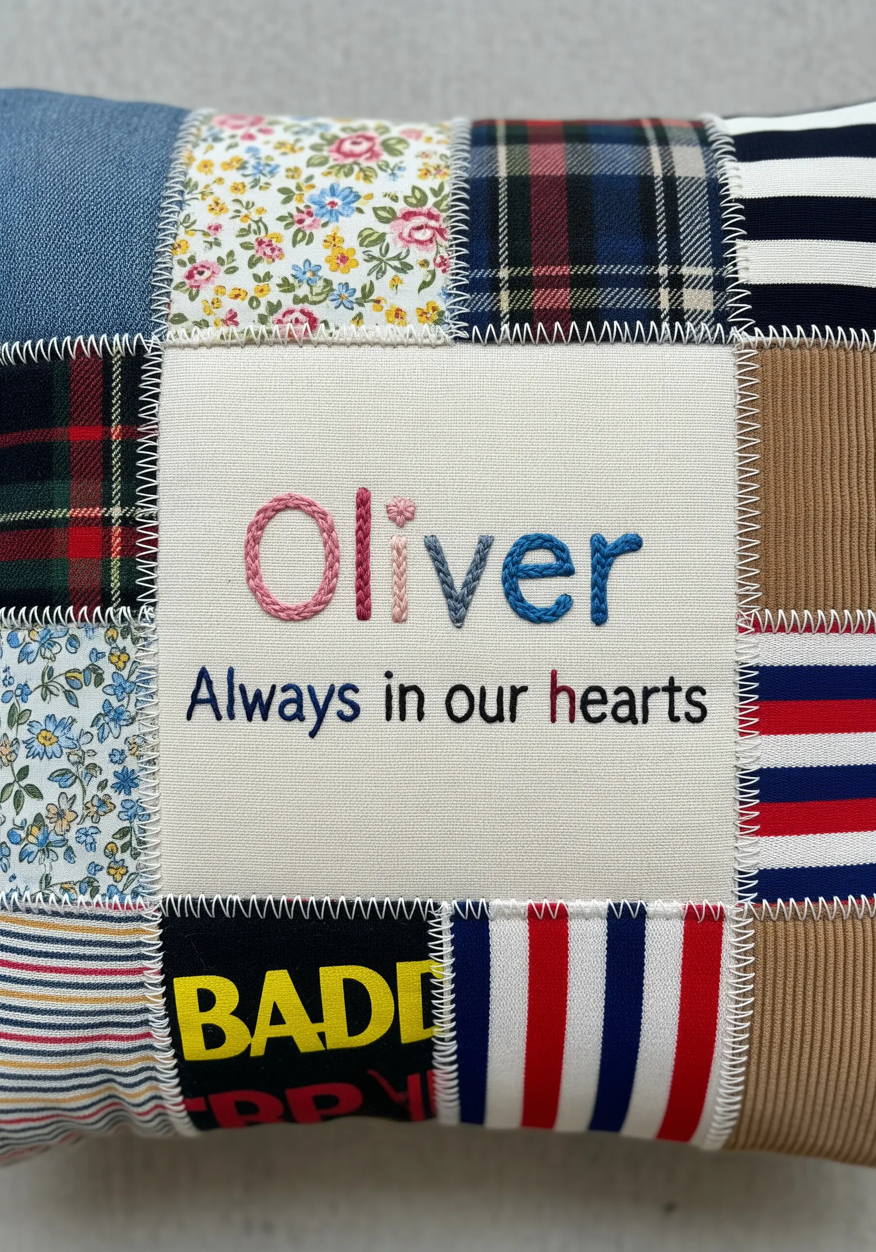 Patchwork fabric cushion with embroidered name Oliver and quote