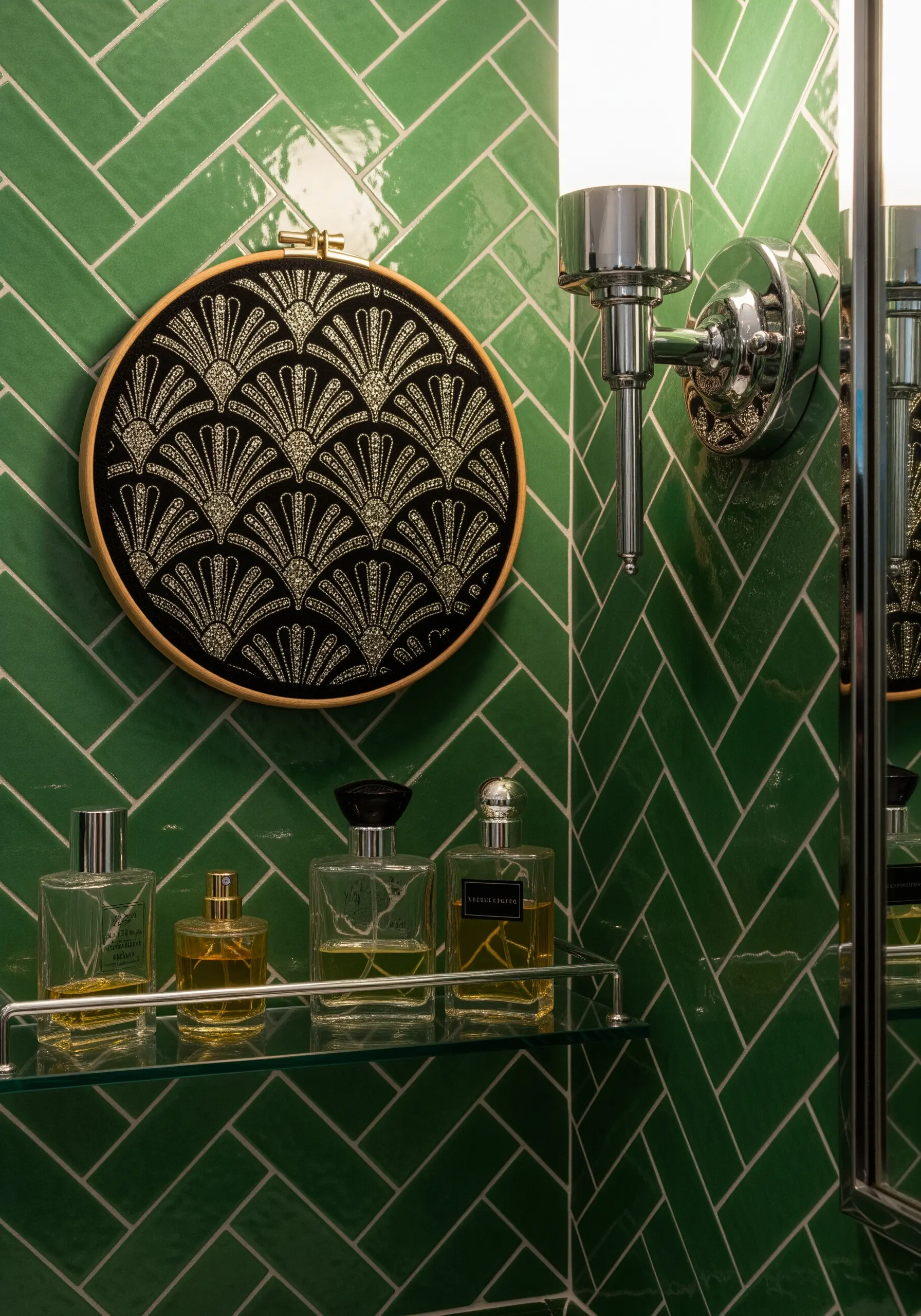 An Art Deco fan pattern stitched in metallic gold thread on black fabric.