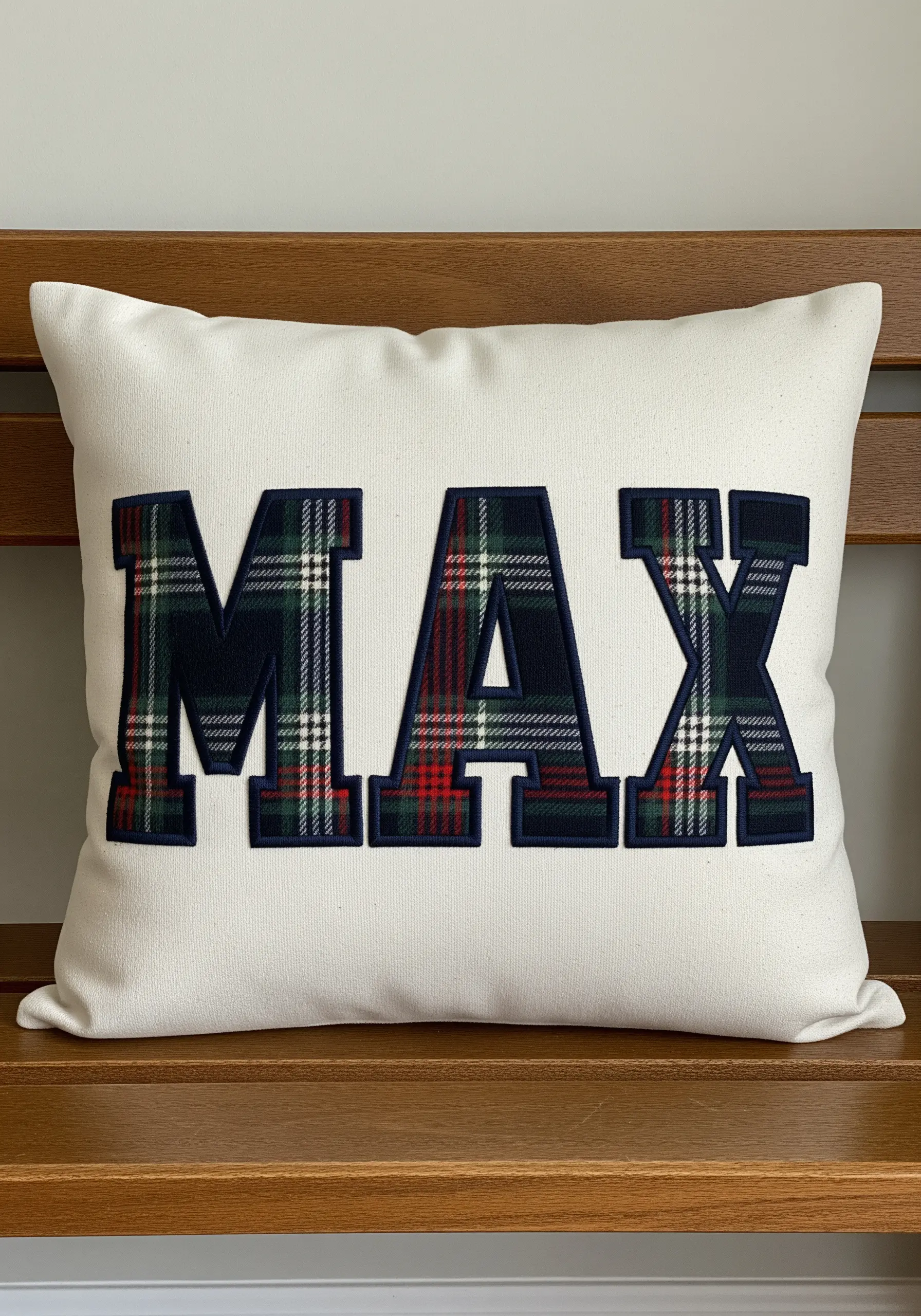 Tartan plaid fabric applique letters spelling MAX on white cushion